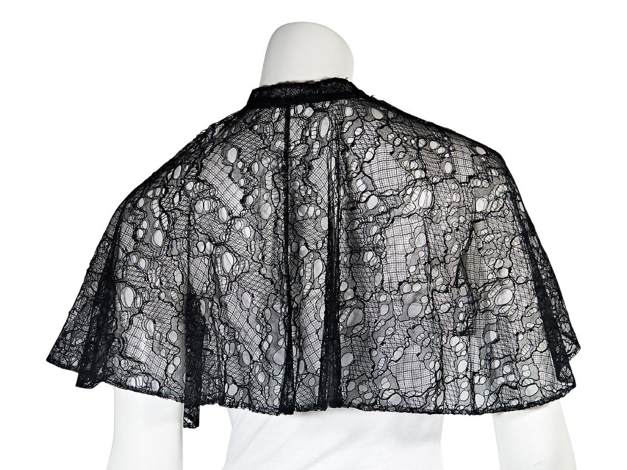 Product details:  Black lace capelet by Alexander McQueen.  Self-tie ribbon closure.  20