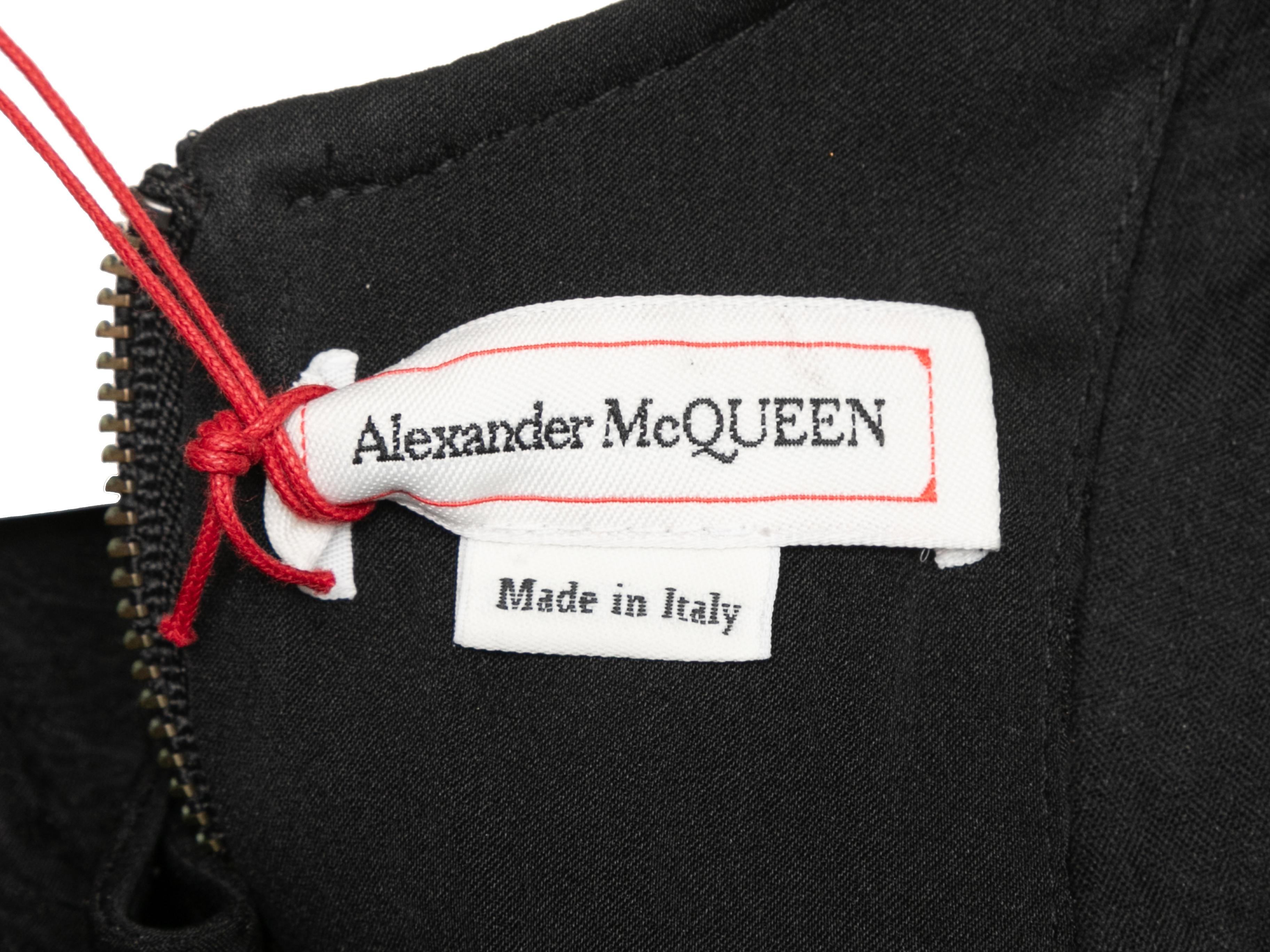 Black sleeveless textured maxi dress by Alexander McQueen. V-neck. Zip closure at back. 36