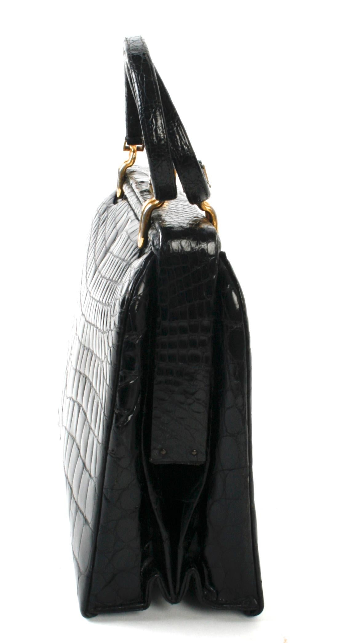 black handbag with gold hardware