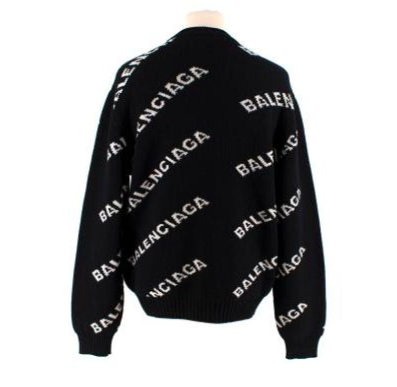 Balenciaga black Allover Logo knit sweater
 

 - Crew neck, slouchy knit with intarsia knitted logo in white 
 - Ribbed collar, cuffs and hemline 
 

 Materials:
 49% Virgin Wool 
 49% Camel 
 2% Polyamide 
 

 Made in Italy 
 

 9.5/10 excellent