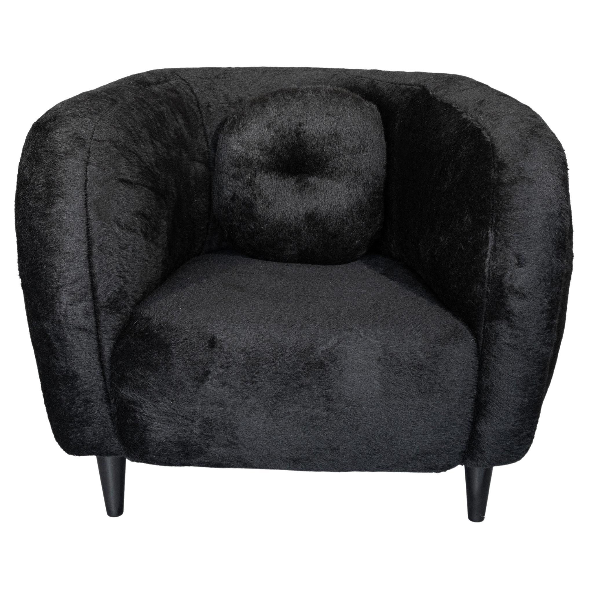 The Le Minitore chairs are made from luxurious, soft, black Alpaca wool in a curved organic design with wooden feet. Imported from France. Designed by Pierre Augustin Rose. 

These custom order Le Minitore chairs have never been touched and are