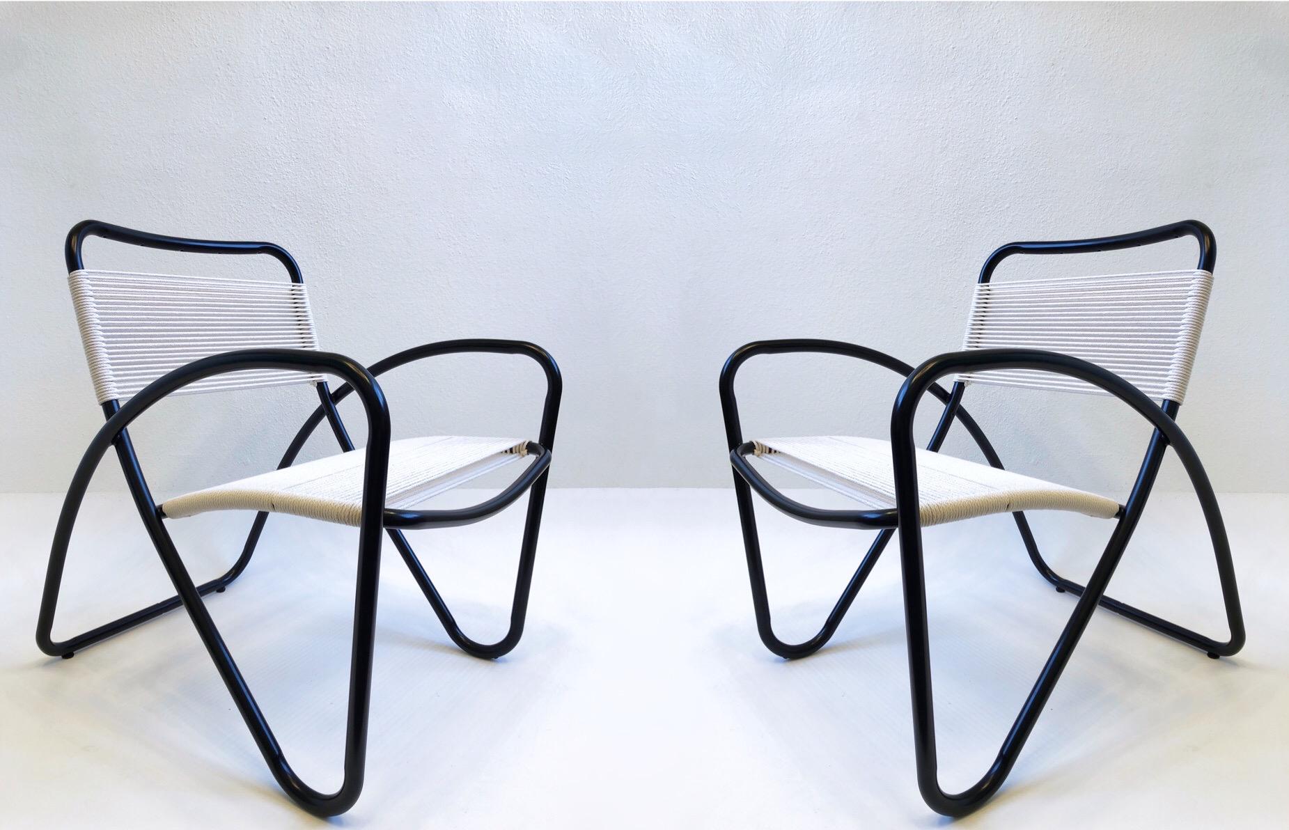 Set of four 1970’s sculptural black powder coated aluminum outdoor lounge chairs by Brown Jordan. 
Newly powder coated satin black and new cotton cord. 
Measurements: 24.5” Wide, 29” Deep 31.25” High, 16.75” Seat, 23.75” Arm.