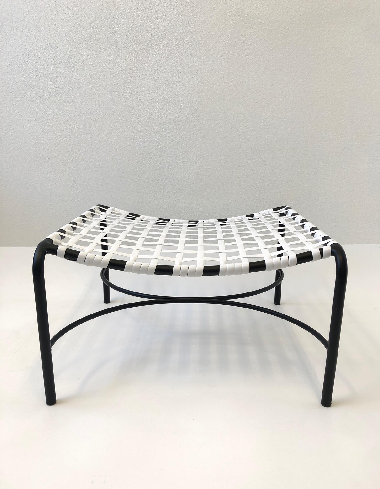 1950’s black powder coated aluminum with white vinyl straps “Katan” ottoman by Brown Jordan. 
Newly professionally restored.
Measurements: 26” wide 25.5” deep 14.75” high.