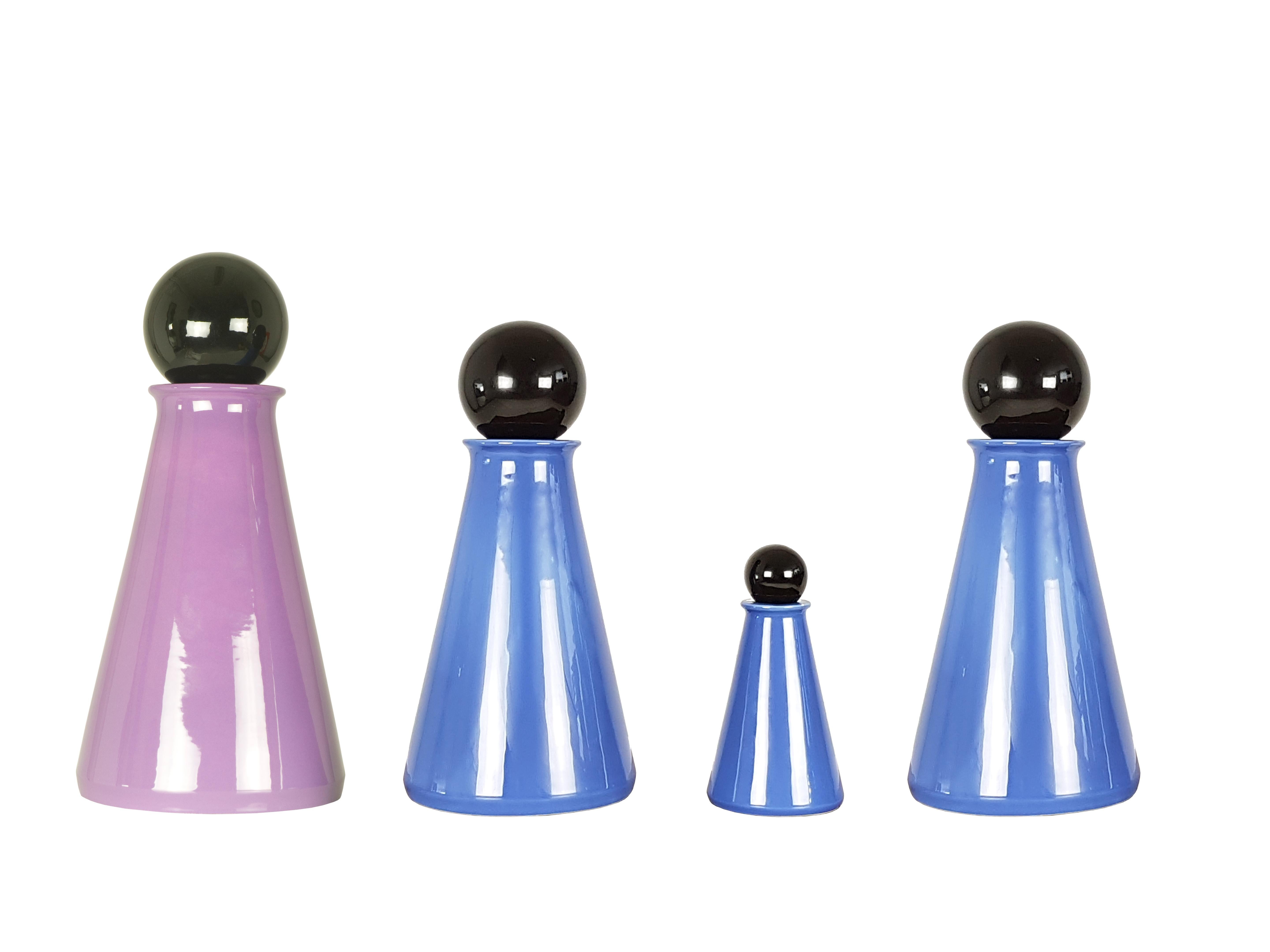 Set of 4 decorative bottles made from blue/violet and black ceramic.
Measures: 
Big bottle: cm 43 H x 21 D
Medium bottle: cm 36 H x 18 D
Small bottle: cm 20 H x 11 D.  
  