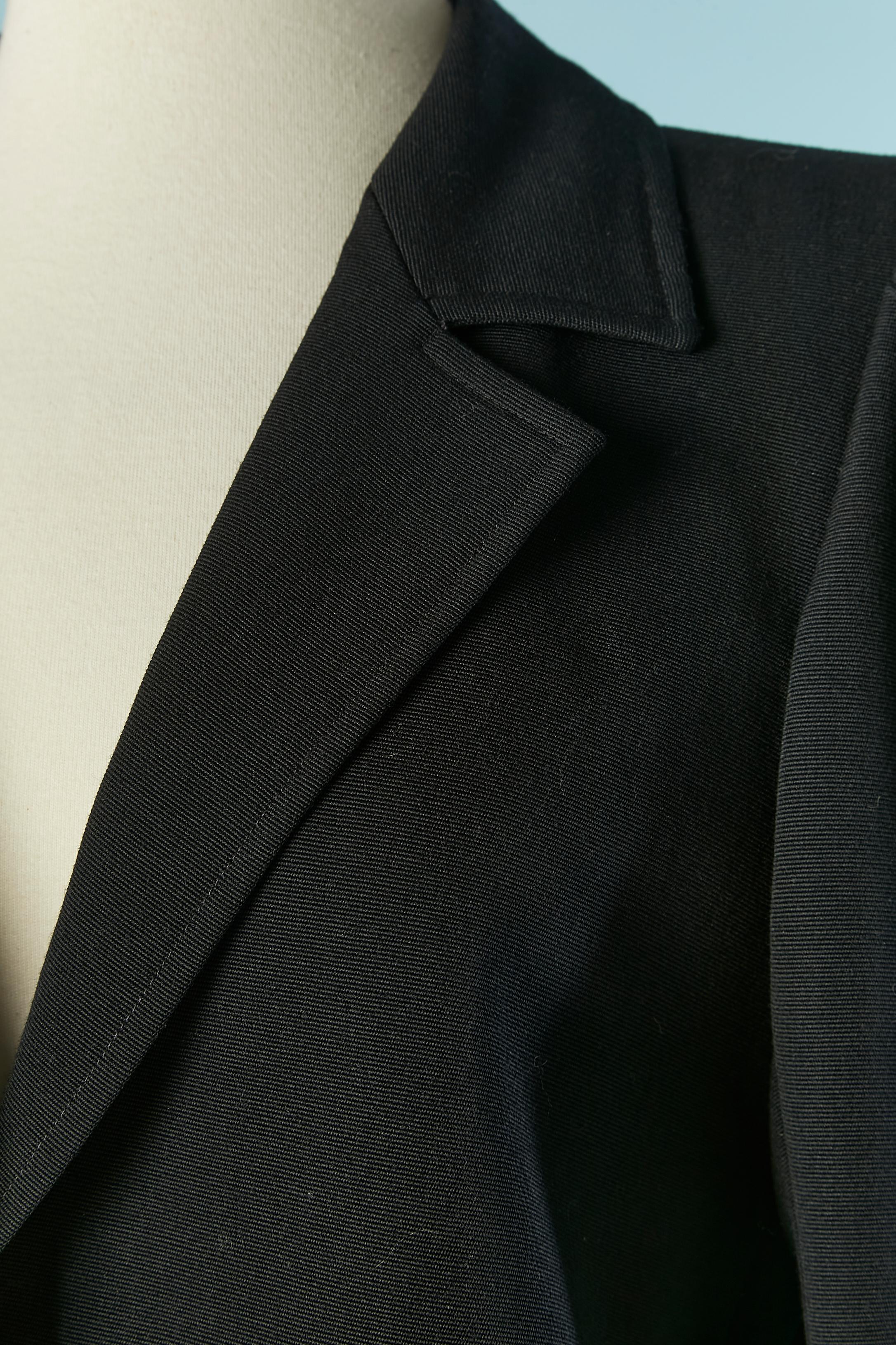 Black and blue wool skirt-suit . Lining composition ( only inside the skirt) is probably acetate or rayon. 
Button and buttonhole closure on the middle front + on the cuffs. 
SIZE OF THE JACKET : 38 (Fr)  M
SIZE OF THE SKIRT  : 38 on tag but fit XS