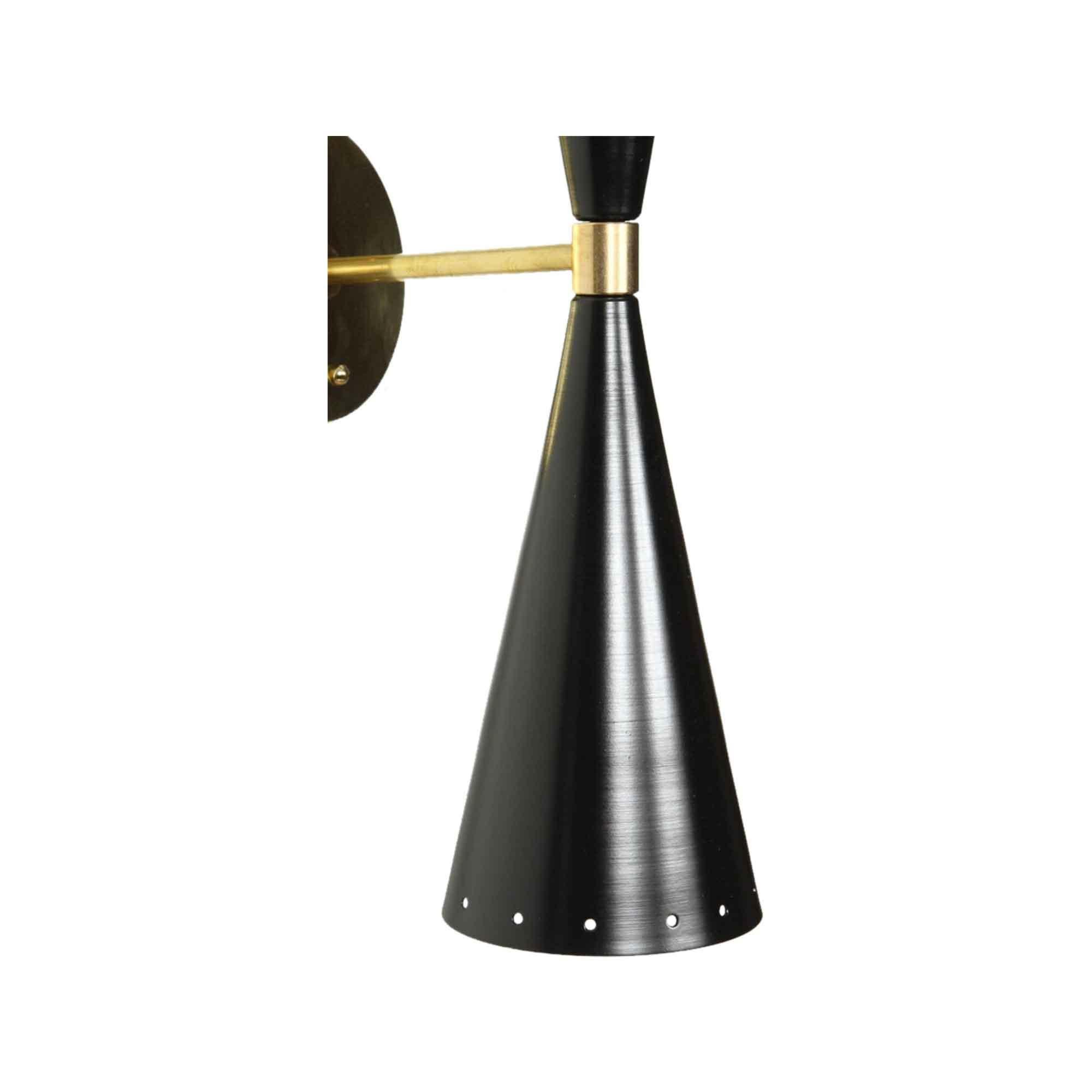 Black and brass double cone sconce by Lawson-Fenning. The double cone sconce features two tapered cones, in either black or white, with small perforations at both ends with a brass backplate and spacer. 

The Lawson-Fenning Collection is designed