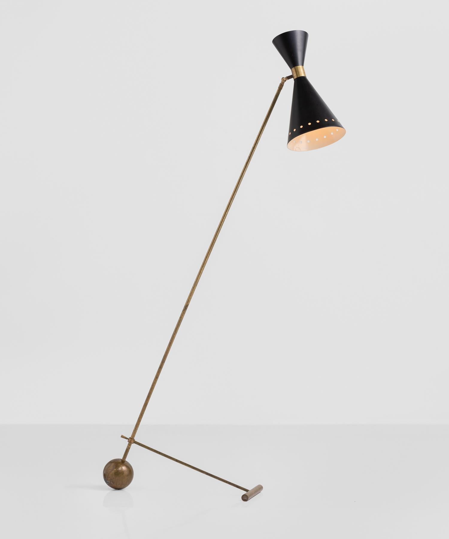 Black and brass floor lamp, Italy, circa 1960.

Modern design with adjustable leg support, which alters the angle of the piece.

Measurements are for configuration as shown.