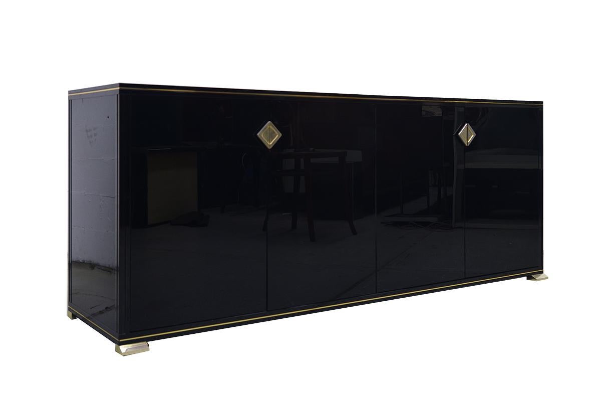 Stunning and rare midcentury sideboard, black lacquered metal and with brass detailing and inlaid glass top designed and made by Pierre Vandel Paris.
