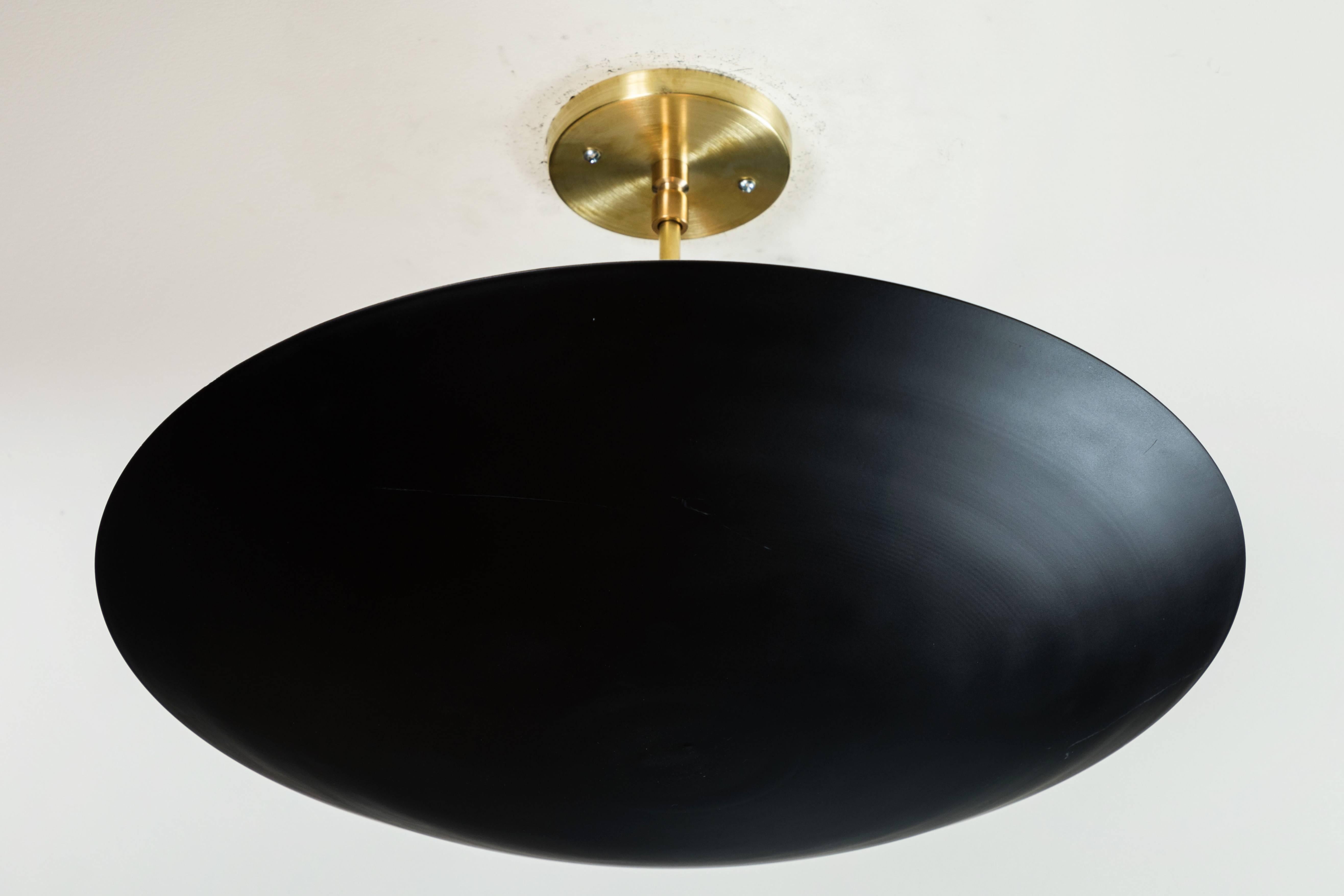 The Alta brass Dome features a spun metal shade with a brass canopy and rod. The shade is available in brass or powdercoated metal finishes. Shown here in matte black powdercoat and satin brass. 

The Lawson-Fenning Collection is designed and