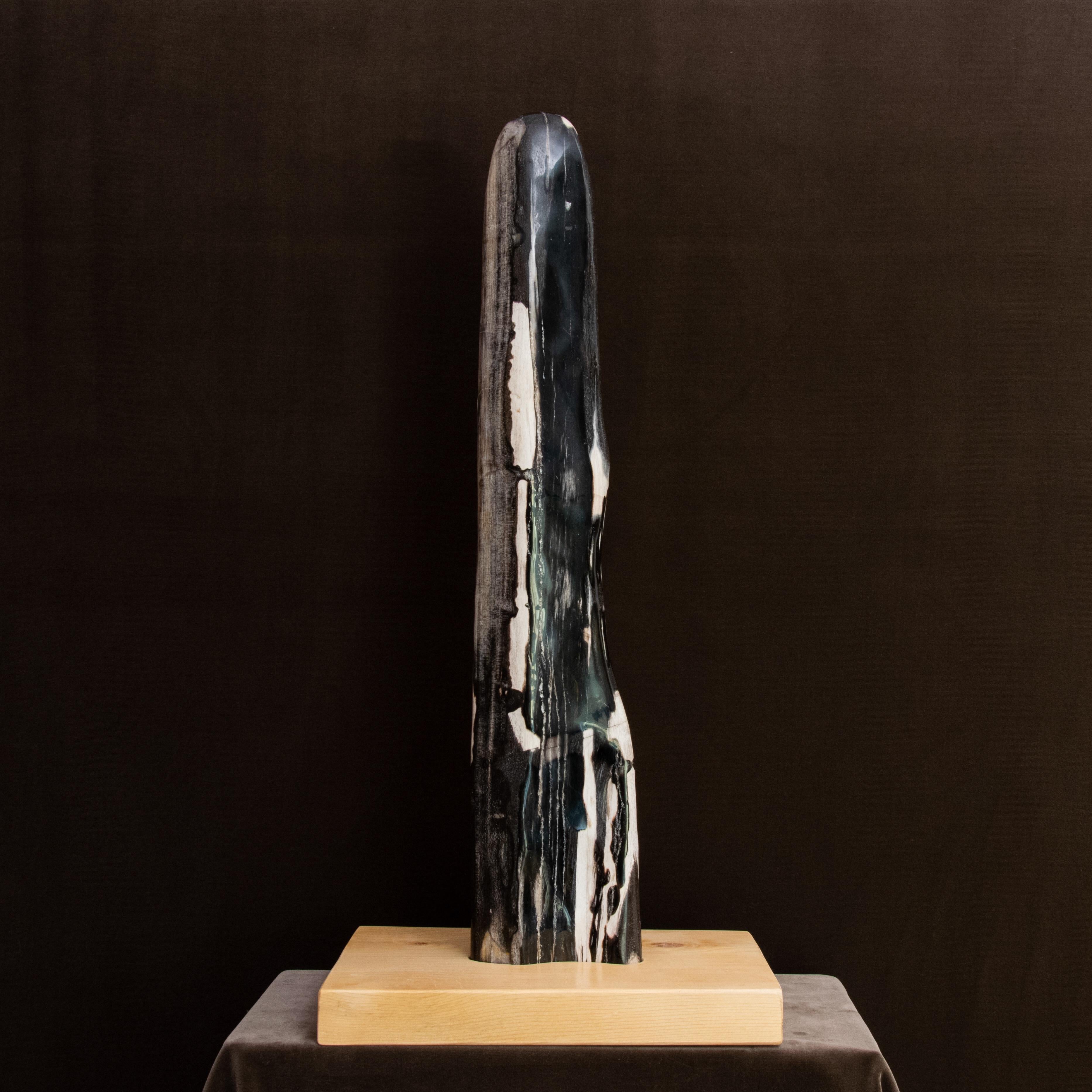 This piece of peerless beauty is a perfect example with proportions and appear that make any interior unique.
The predominant color is a gradation of black with white veins.
The natural wood base was specially made to hold the mineral. Not only does