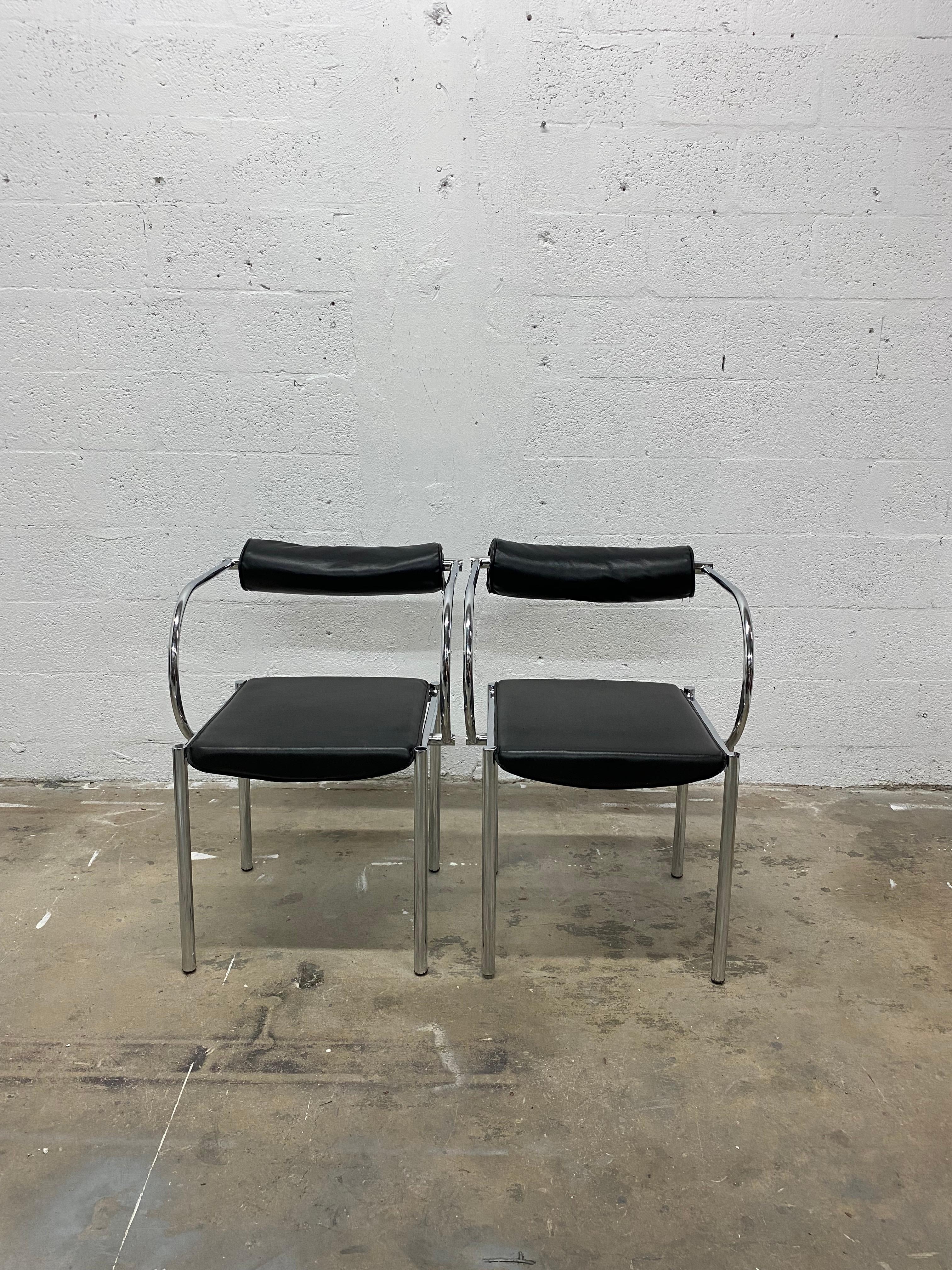 Pair of Postmodern design chairs with black naugahyde seat and foam back on a polished chrome tubular frame. Manufacturer unknown.