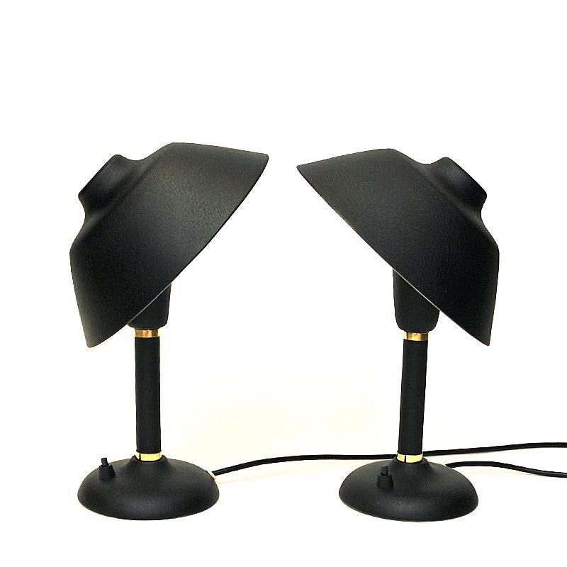 Lovely and classic pair of metal tablelamps with small brass details on the body. Produced by Gemi - Sweden 1950s. Looks good in your home or even your office. The lamps have adjustable shades for all directions - and can be removed completely. Good