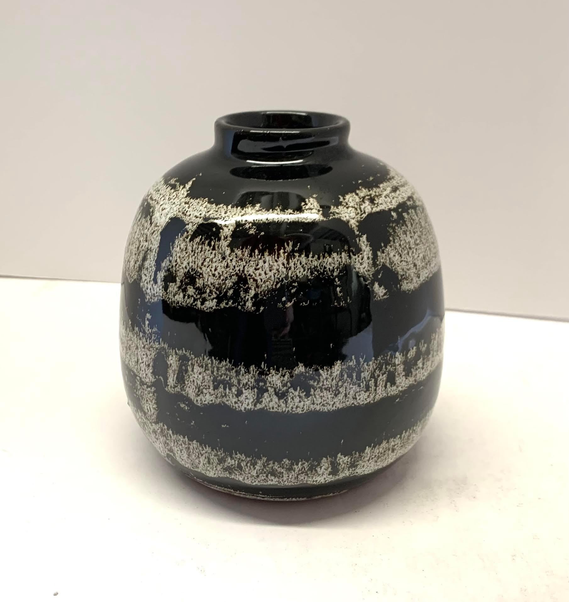 Contemporary Chinese speckled black and white glaze with a horizontal stripe.
Two are available and sold individually.