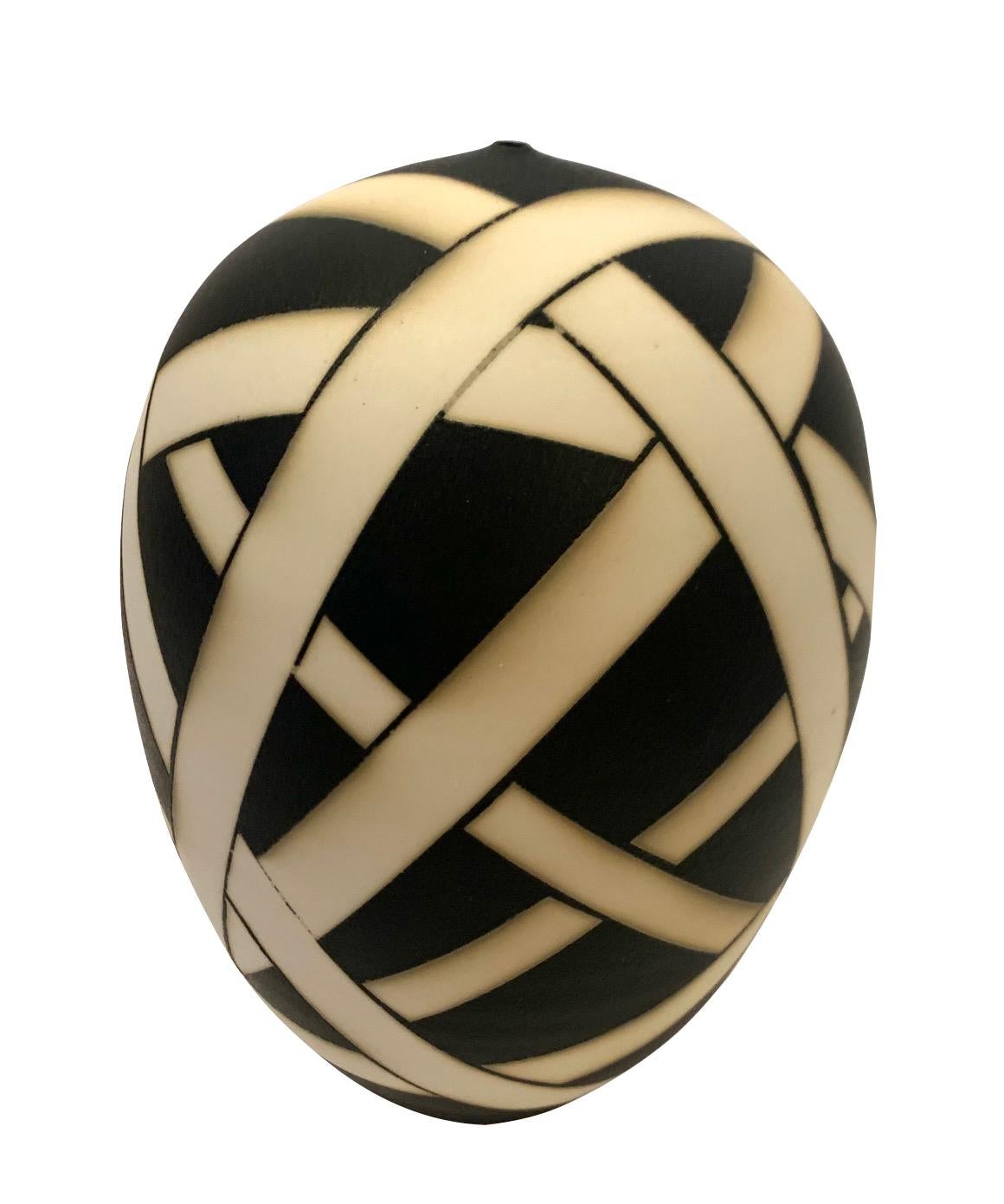 Contemporary made in the USA porcelain black and cream geometric stripe pattern design.
Black ground with white free form bands surrounding the vase.
Hand made one of a kind.