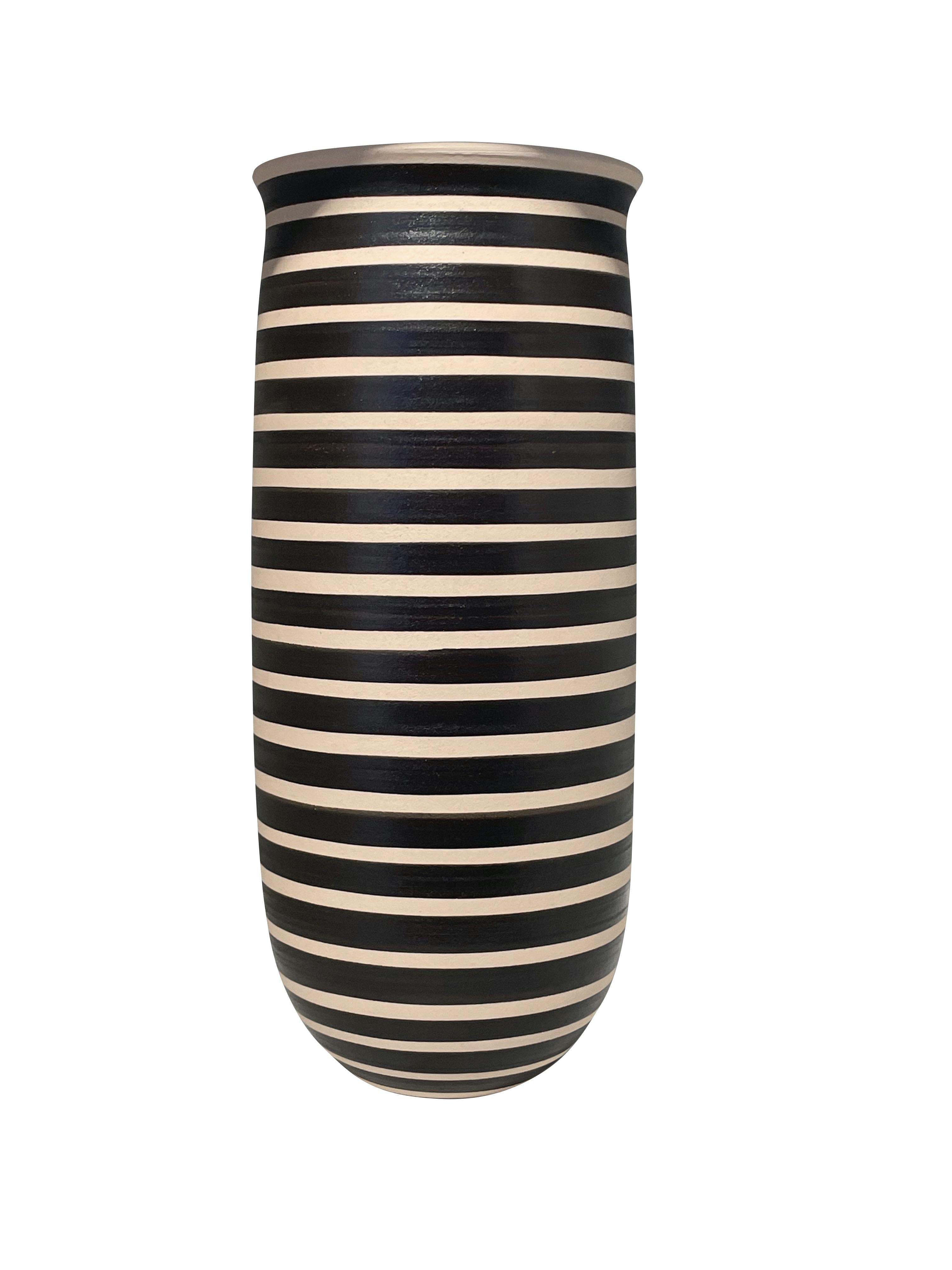 Contemporary Turkish handmade black and cream tall wide band stripe vase.
Wide opening.
Can hold water.
Two available and sold individually.
From a large collection.