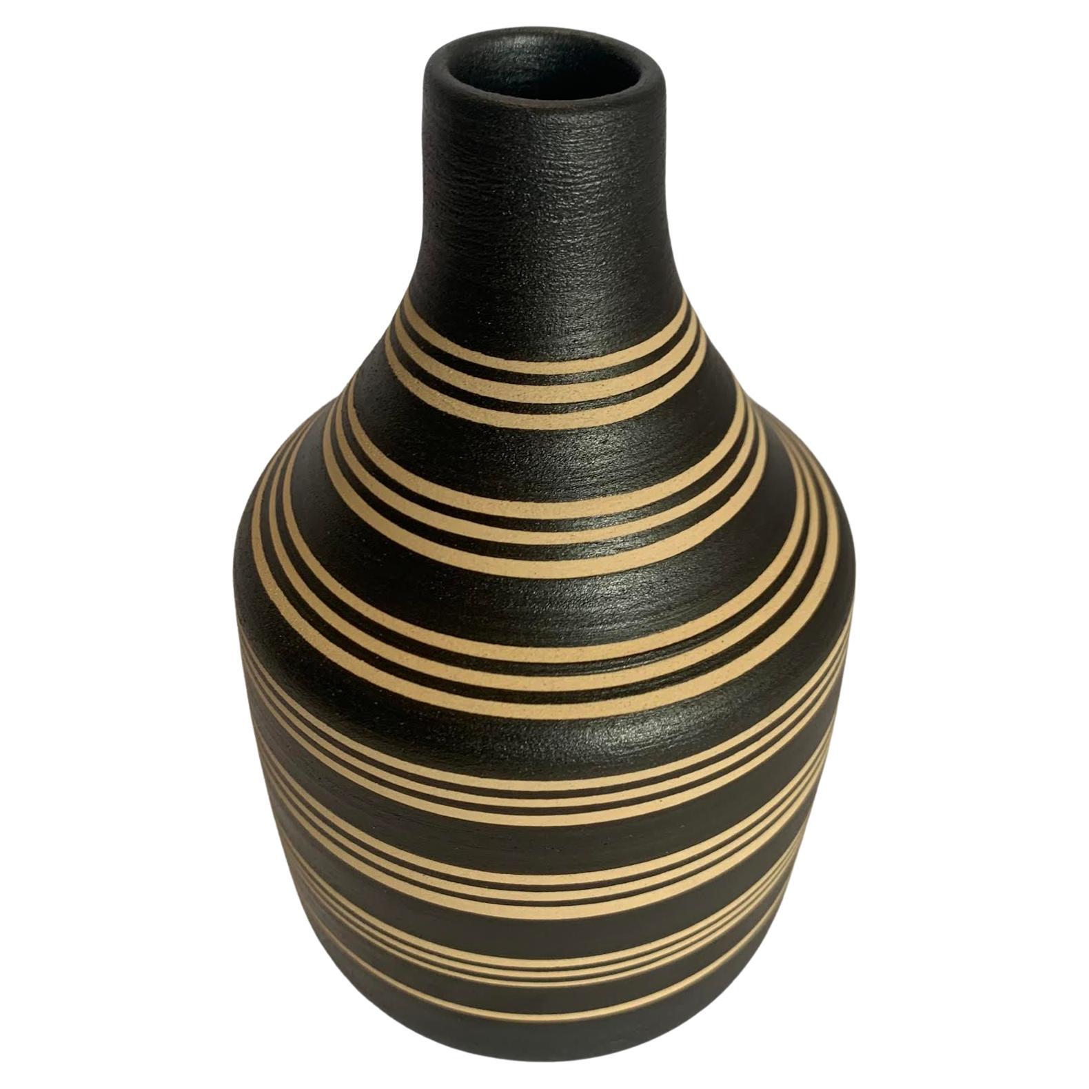 Contemporary Turkish handmade black and cream triple band stripe vase.
Can hold water.
Two available.
From a large collection.