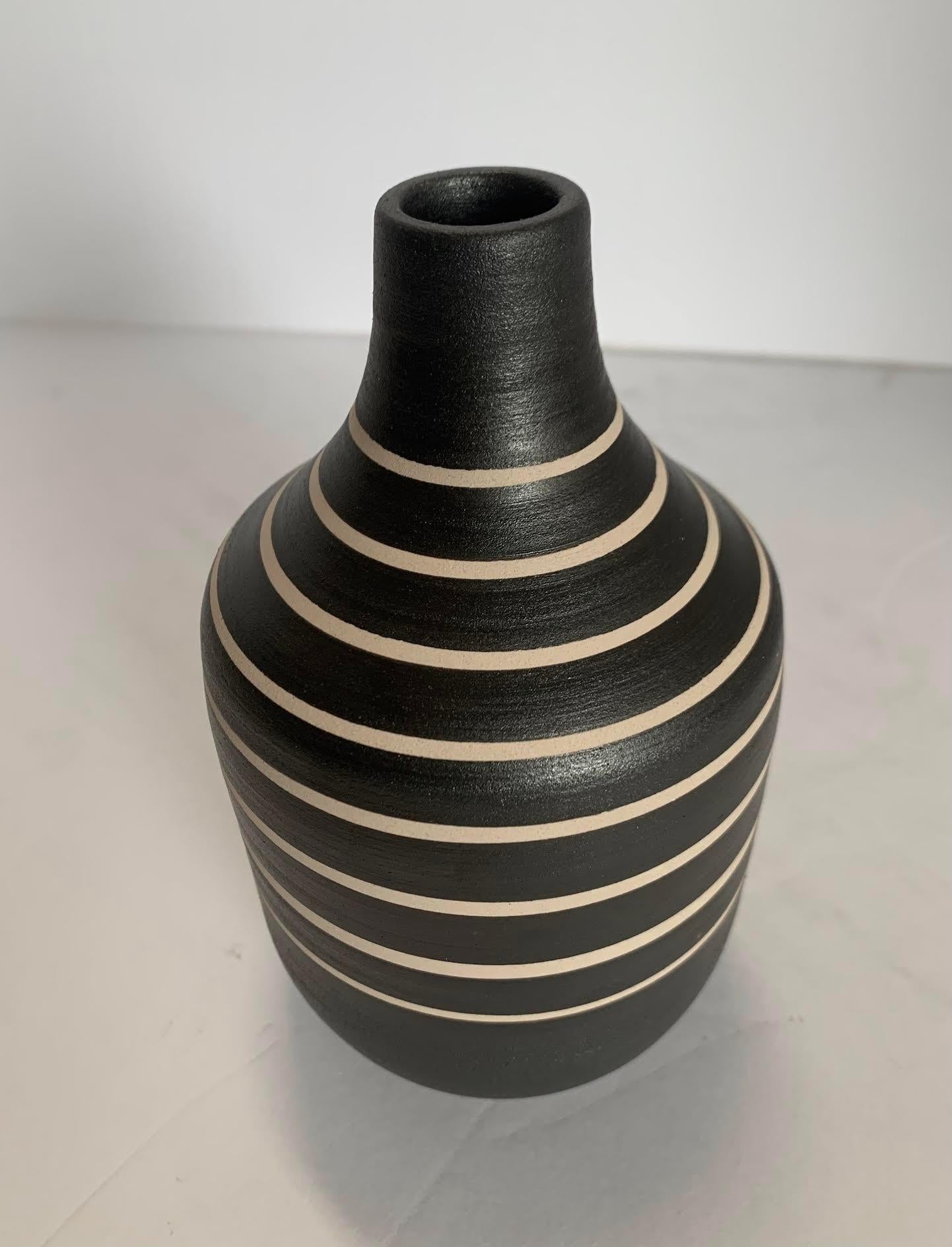 Contemporary Turkish handmade black and cream wide band stripe vase.
Can hold water.
Two available.
From a large collection.