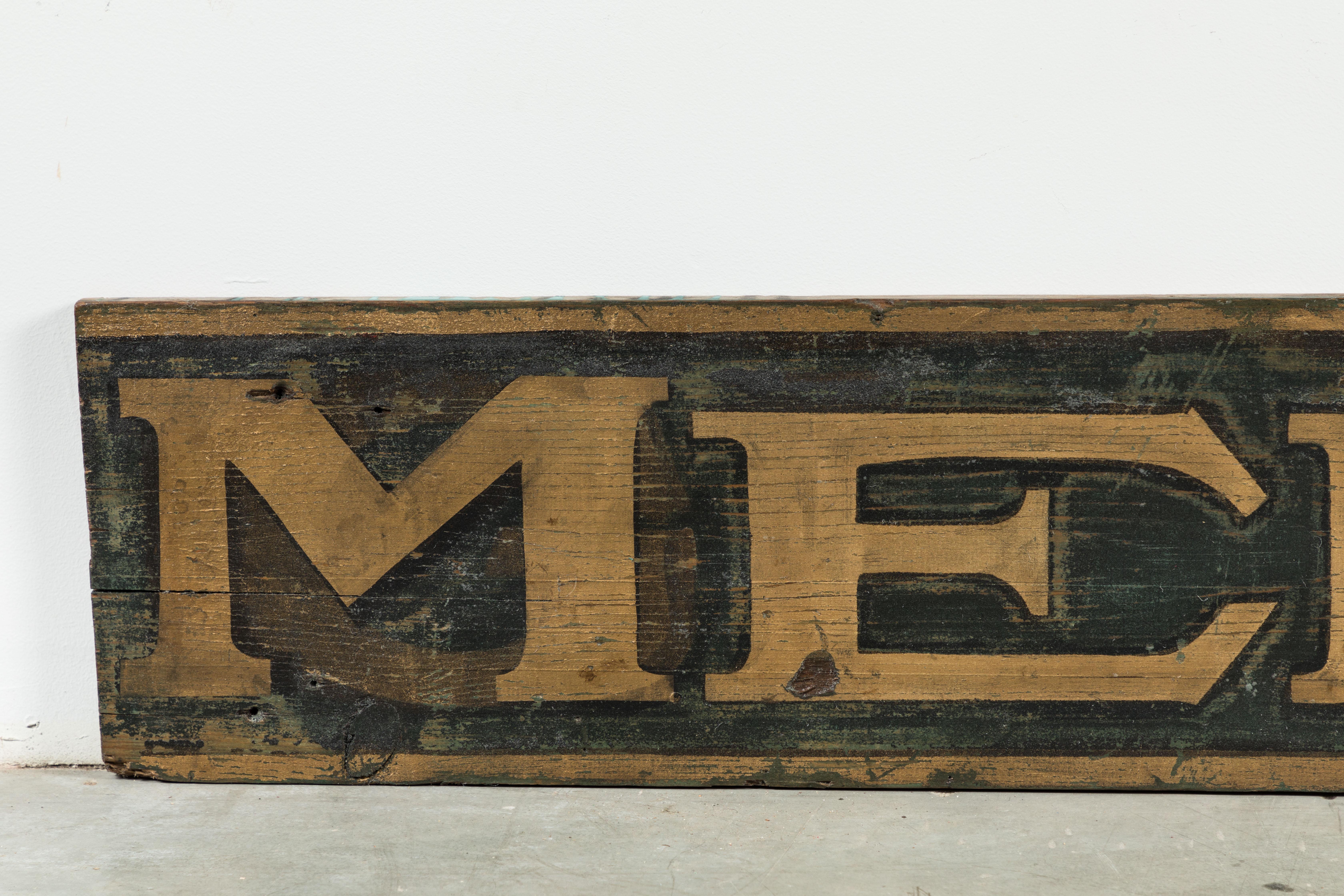 Simple and graphic 19th century American department store or general store men's sign. Gold lettering and border and black background. Original paint surface. Sign shows its age. Some cracking, but a solid and sturdy sign that looks great.