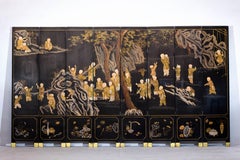 Black and Gold Lacquered Eight-Panel Screen with Monks and Children Scene