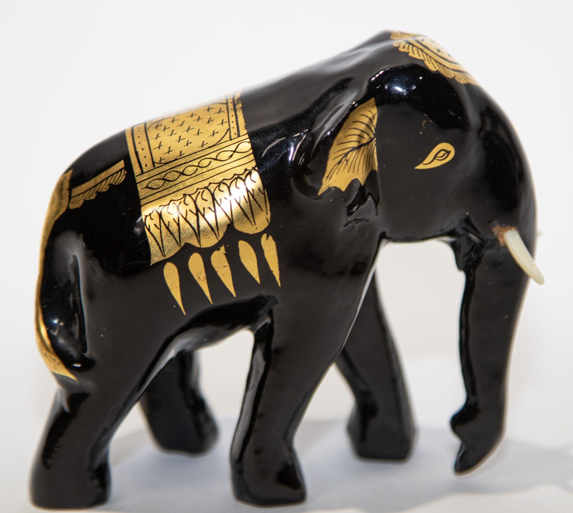 Folk Art Black and Gold Lacquered Thai Elephant Sculpture For Sale
