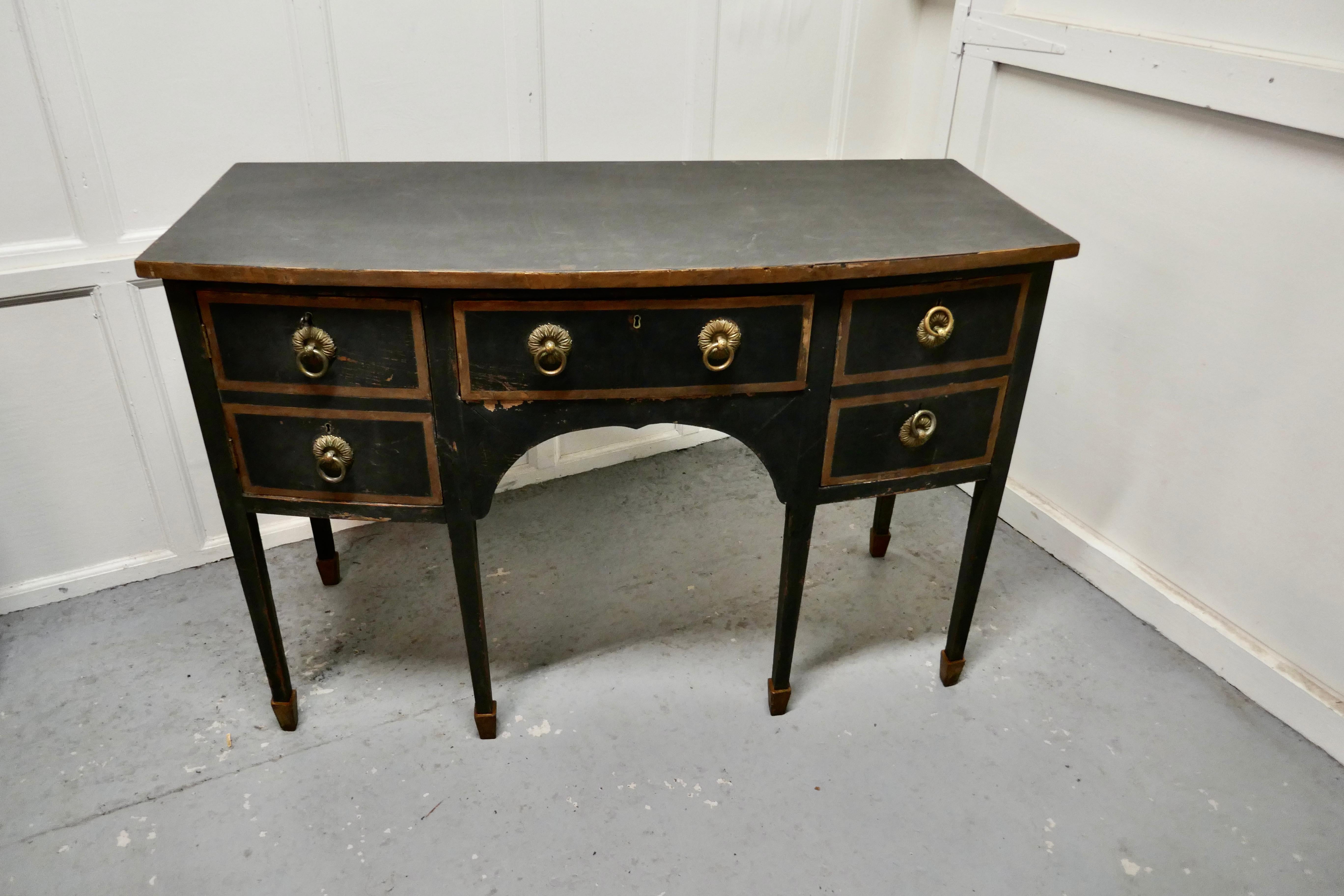 Black and gold Regency bow front serving table, with Cellerette

This very unusual piece has one central drawer, to the left and right sides it has 2 double drawer fronts, one is a large cupboard and the other is a double depth drawer originally
