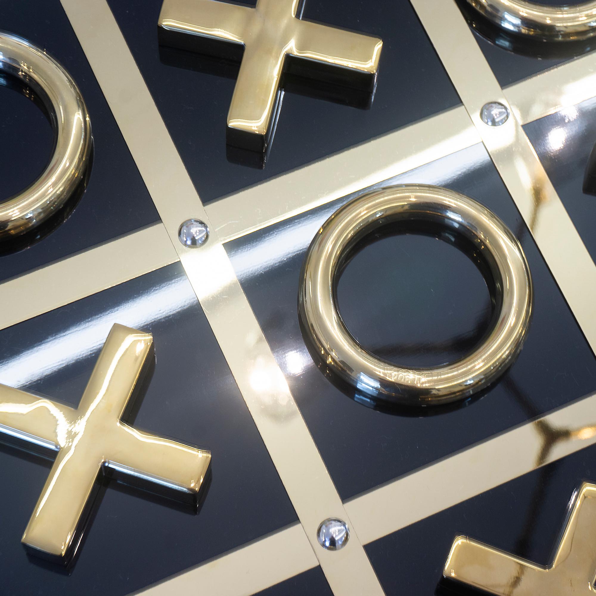 A luxury game night is ready with this black and gold Tic Tac Toe set made out of high quality acrylic with gold accents. Comes with 5 X’s and 5 O’s. 

Dimensions: 2