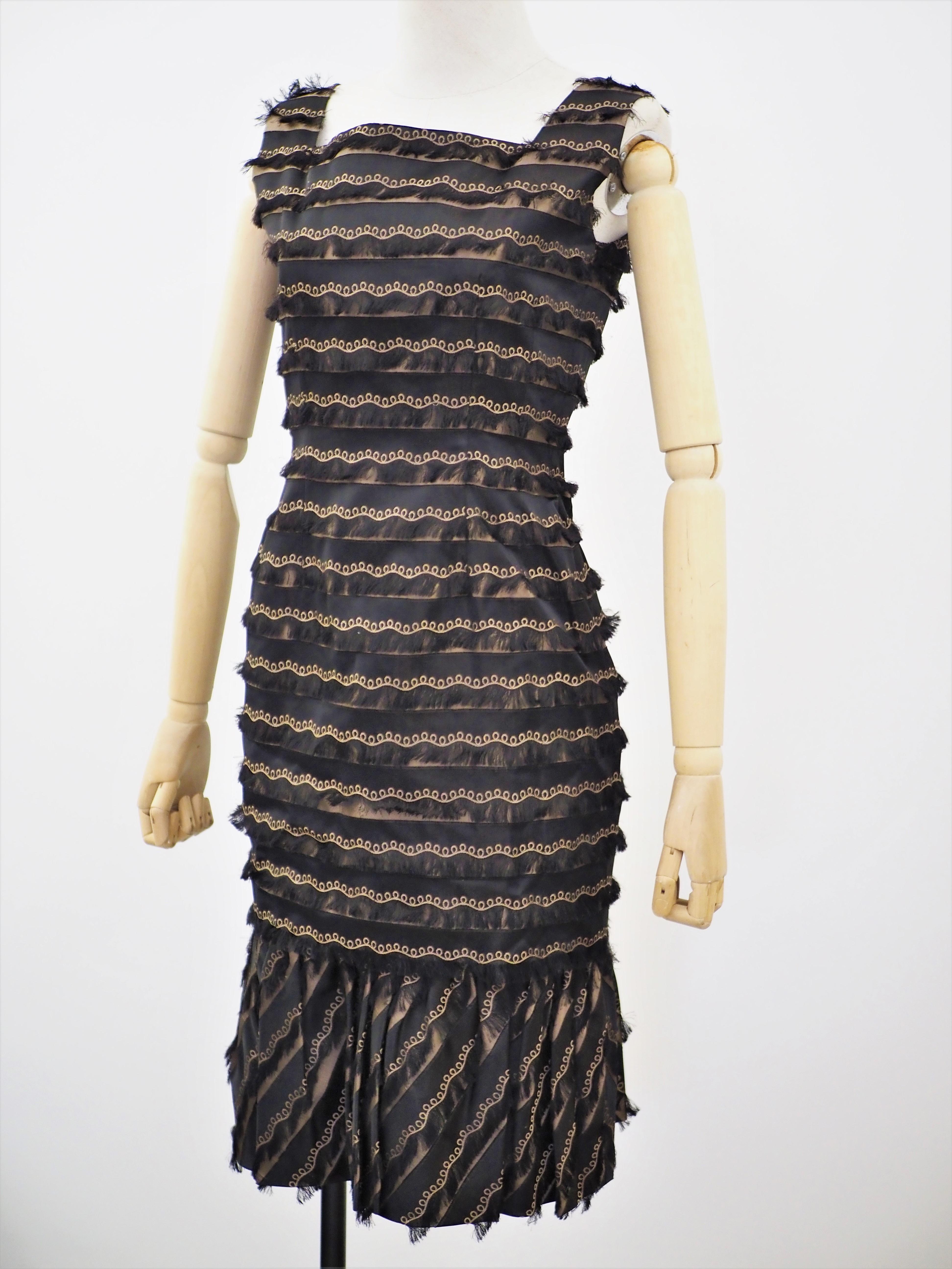 Black and gold top and skirt suit dress
totally made in italy