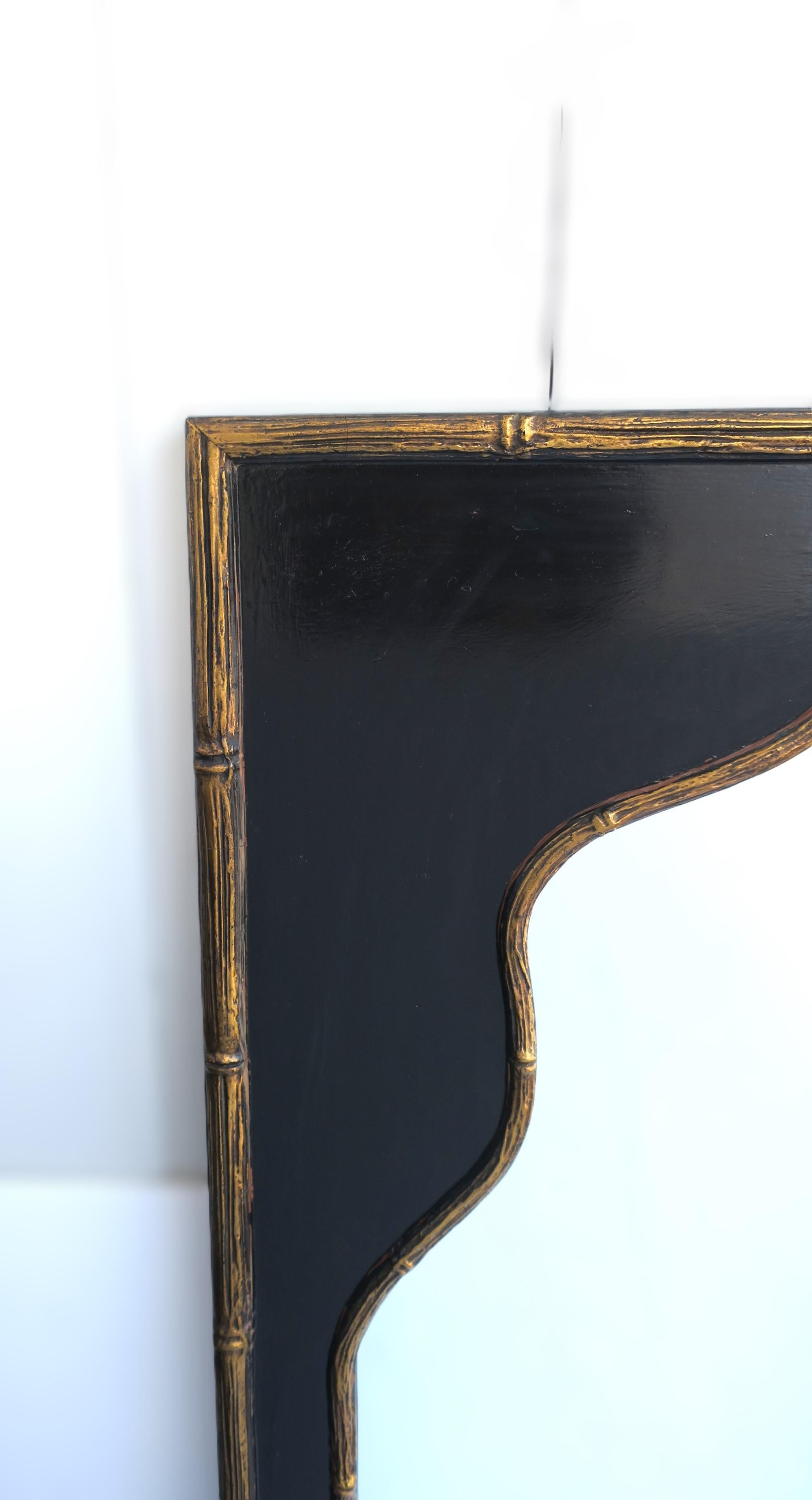 Mid-20th Century Black and Gold Wall Mirror with Moorish Bamboo Detail