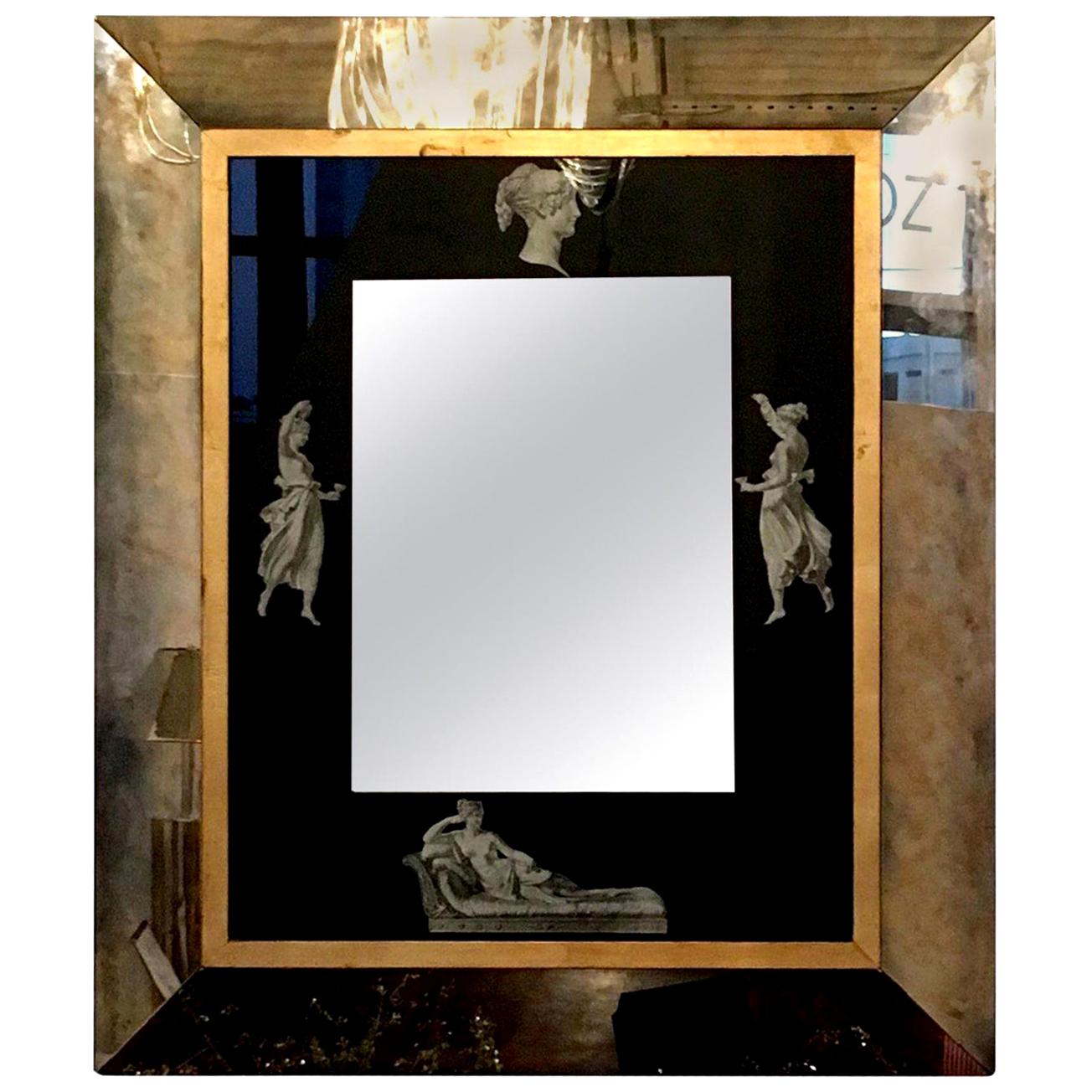 Offered is a Mid-Century Modern Italian black, gold and white Grecian figures neoclassical antiqued mirror with substantial wood back and hanging mechanism. This piece has been manufactured by using a method referred to as 