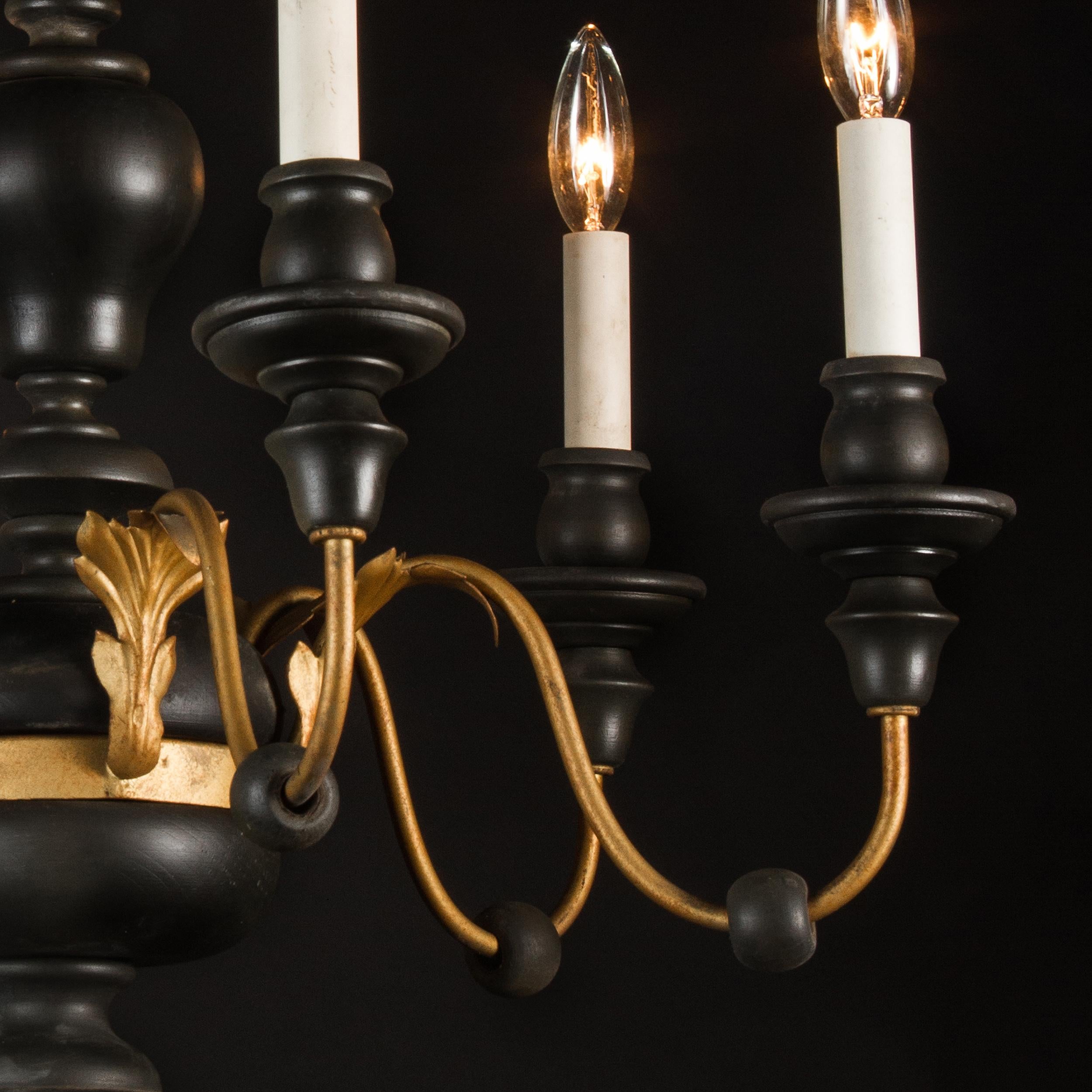 Dating to the mid-20th century, this simple and elegant chandelier is stylistically Louis XVI. Made primarily of wood, the fixture also has decorative iron and tile elements found at top and on the bases of the arms.
Each piece in our shop is