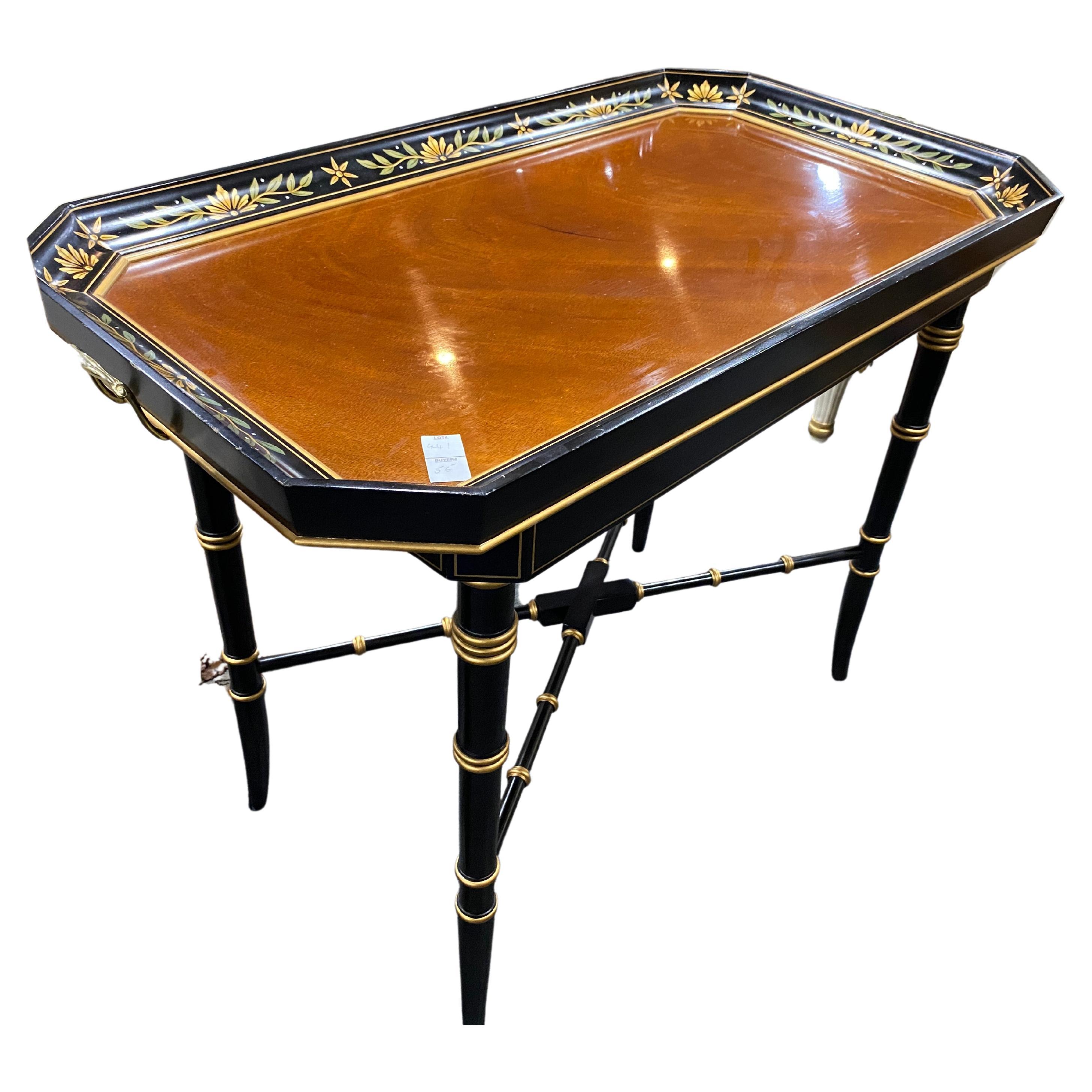 Stunning wooden tray table with faux bamboo leg design. hand painted, brass handles. 

Very good quality Kindel Tea Table, hand painted”
Time Period Manufactured
Post-1950 Original

Stylish wooden tray table accentuated with hand painted leaf