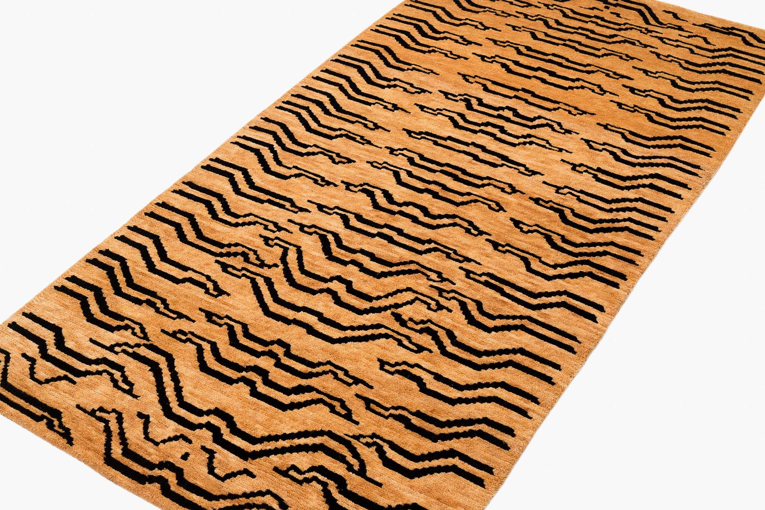 This rug is woven in a special weaving project in a women's coop using special lost weaving techniques. We use secret knotting techniques to make special effects. 

The rug is woven in all natural botanical dyes and is extremely authentic. The tiger