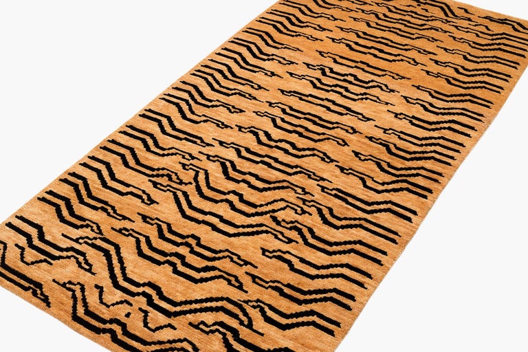 This rug is woven in a special weaving project in a women's coop using special lost weaving techniques. We use secret knotting techniques to make special effects. 

The rug is woven in all natural botanical dyes and is extremely authentic. The tiger