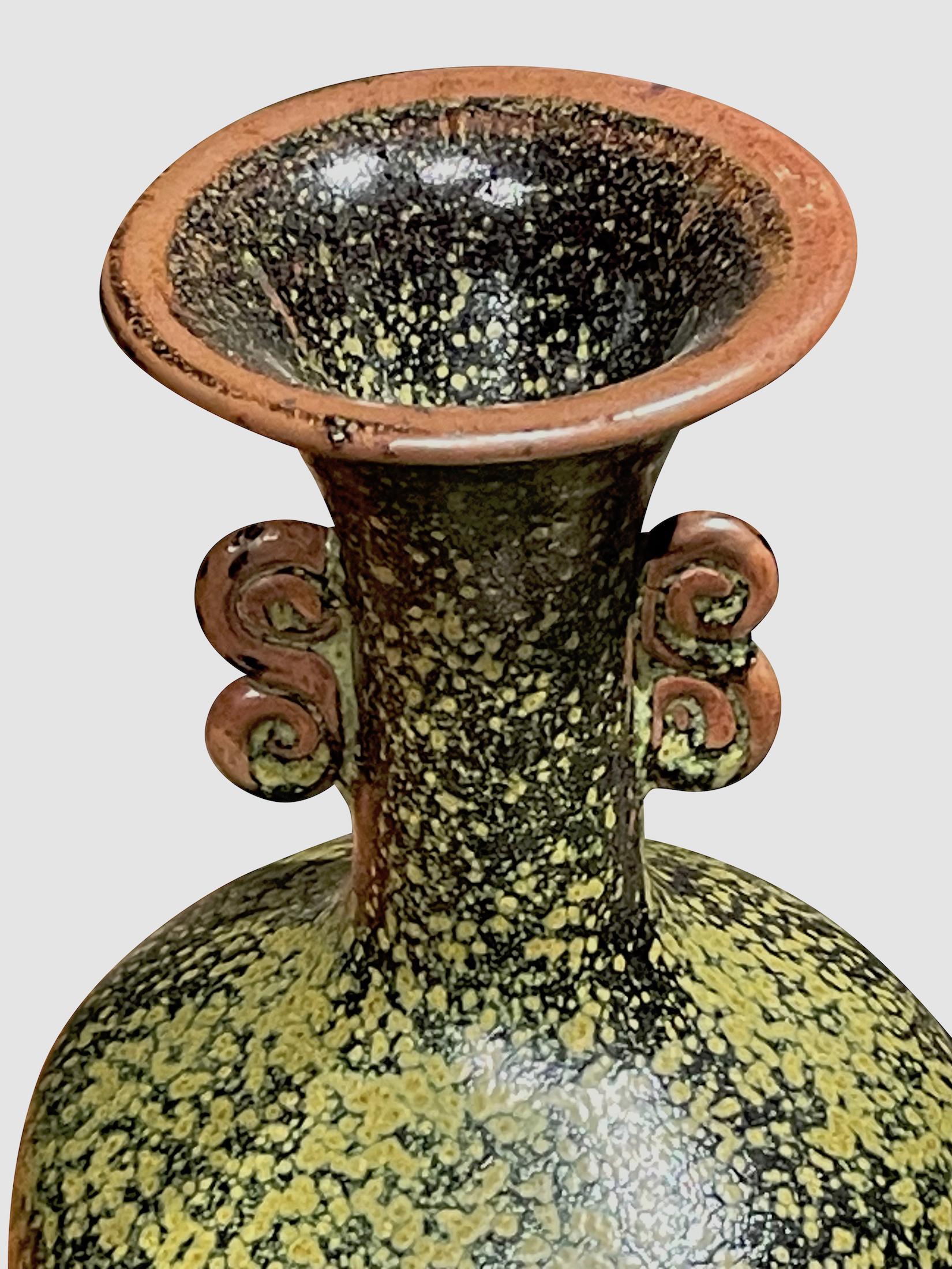 Contemporary Chinese black and green speckled glaze vase.
Classic shape with tall neck and two handles at wide spout opening.
One of three from a collection that sit well together. (S6412/6413 )