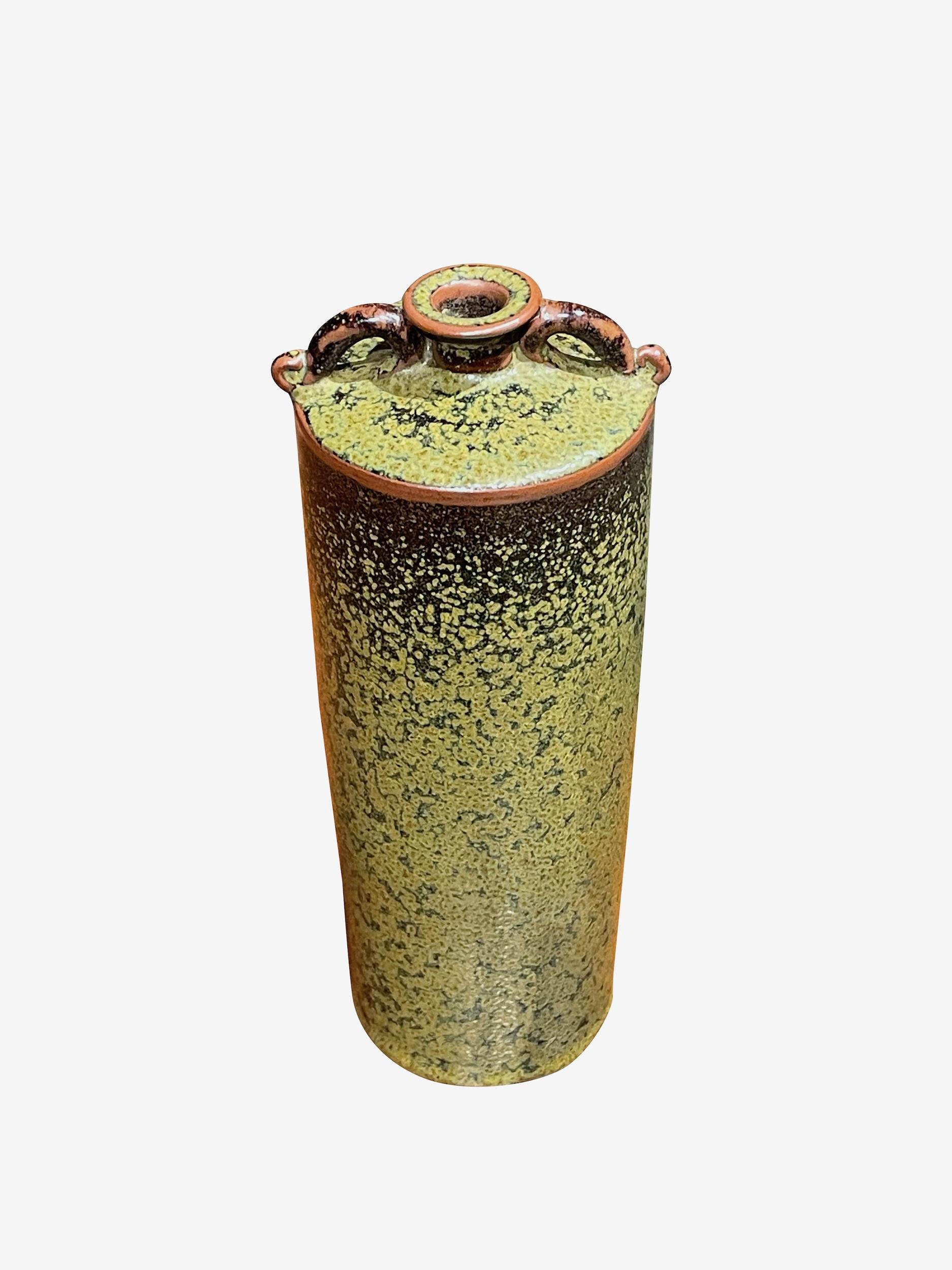 Contemporary Chinese black and green speckled glaze vase.
Cylinder shape with two small handles at small spout opening.
One of three from a collection that sit well together. ( S6412 / S6414 )