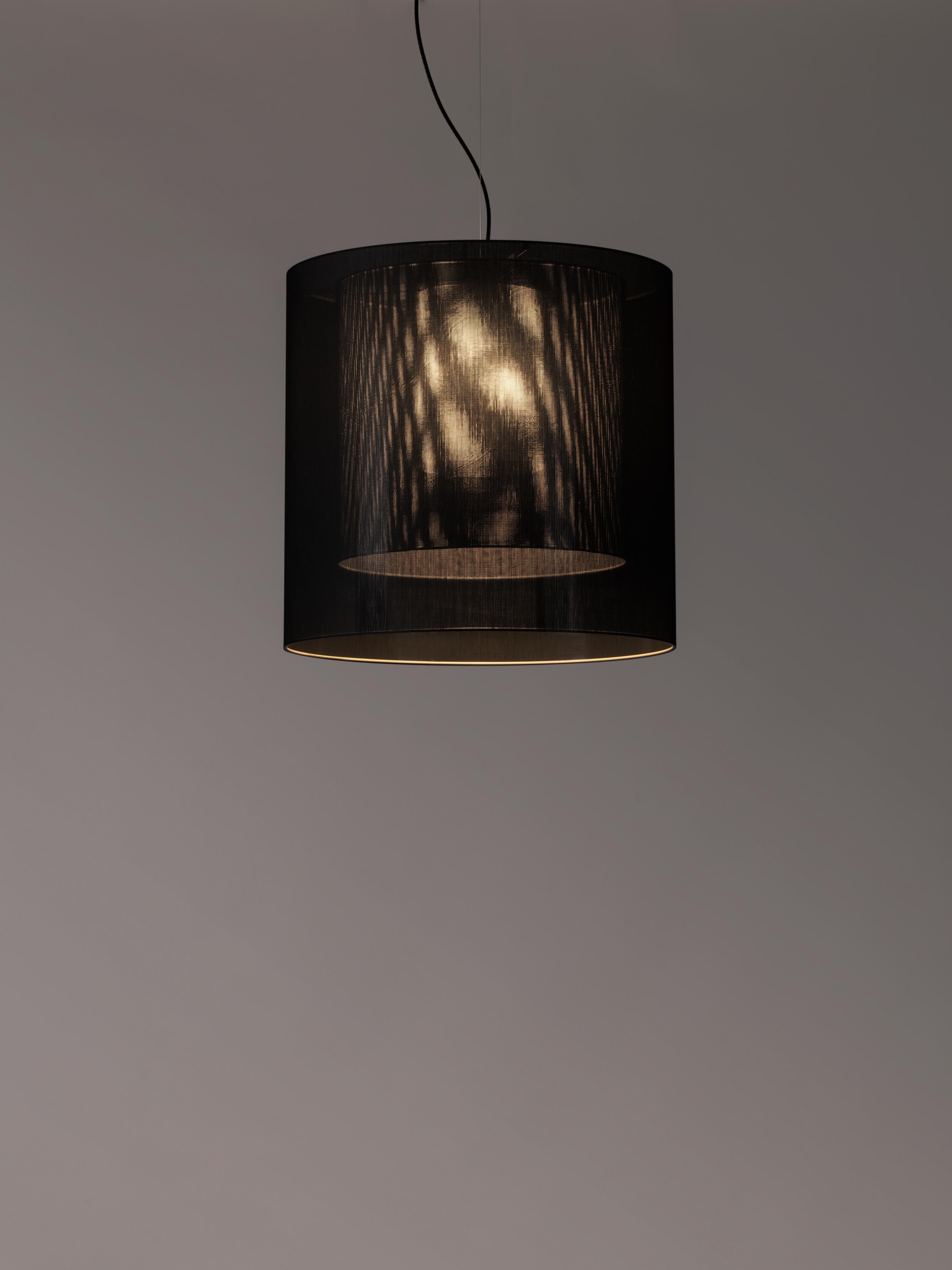 Black and grey moaré LM pendant lamp by Antoni Arola
Dimensions: D 62 x H 60 cm
Materials: Metal, polyester.
Available in other colors and sizes.

Moaré’s multiple combinations of formats and colours make it highly versatile. The series takes