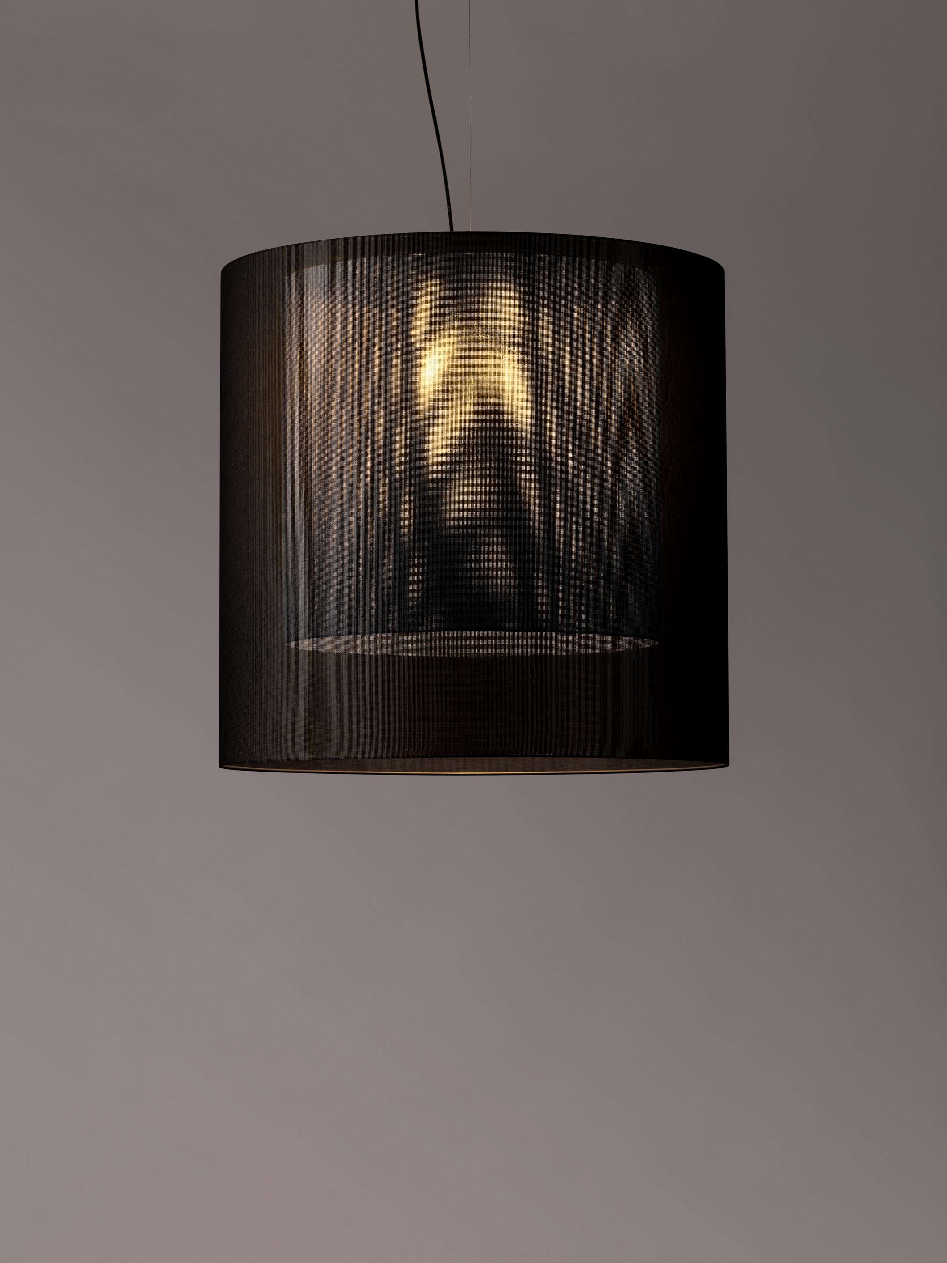 Black and grey Moaré XL pendant lamp by Antoni Arola
Dimensions: D 83 x H 81 cm
Materials: Metal, polyester.
Available in other colors and sizes.

Moaré’s multiple combinations of formats and colours make it highly versatile. The series takes