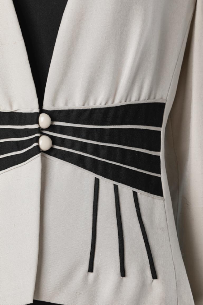Black and grey silk  jacket with cutwork on the waist. pale grey silk lining. 
SIZE 36 (S) 