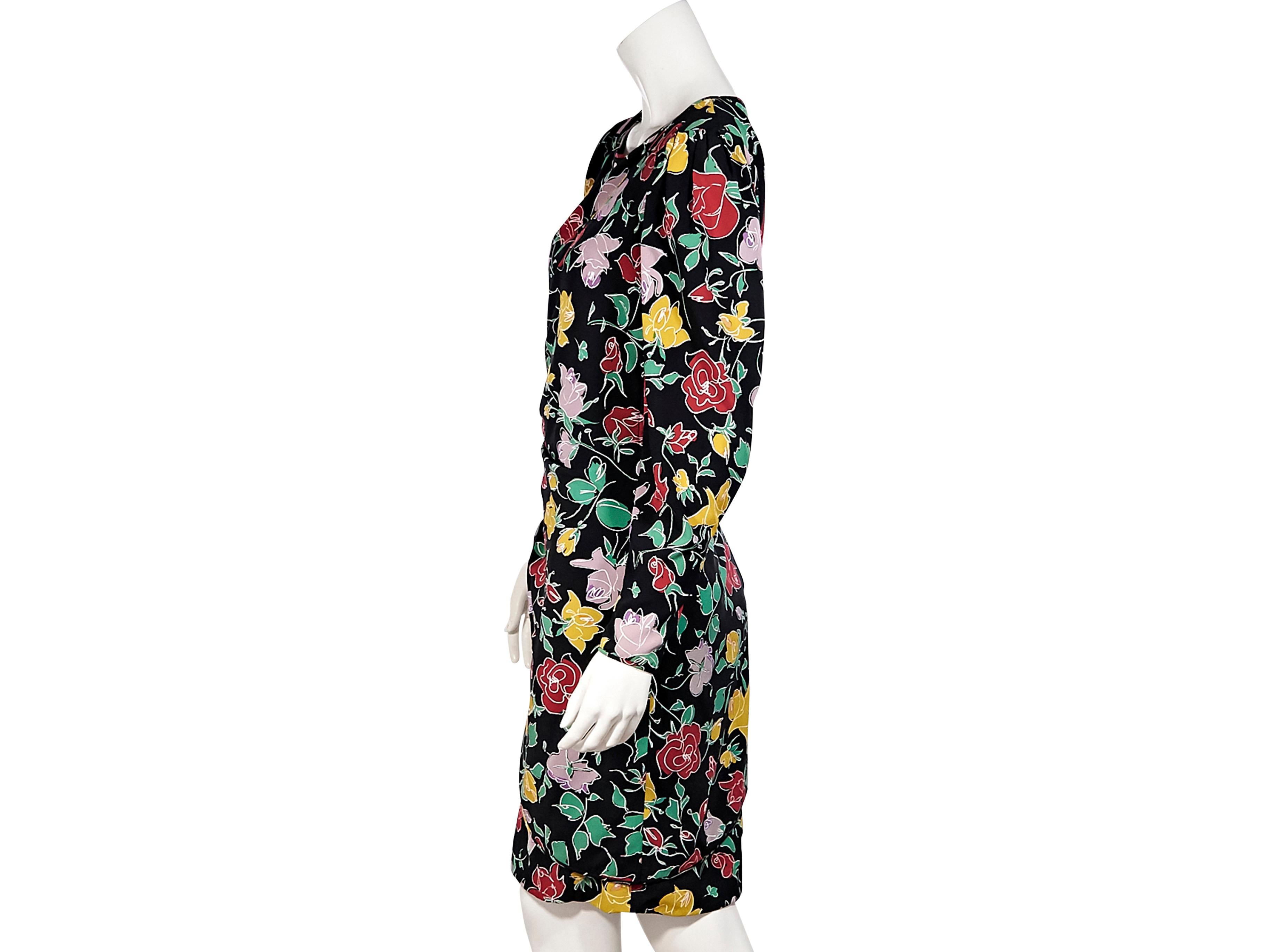Product details:  Black and multicolor floral-printed silk knee-length dress by Ungaro. Draped at front. Tie at side. Scoop neck. Puff shoulders. Long sleeves.  Concealed back zip closure. Pair yours with patent leather Mary Jane pumps. 34