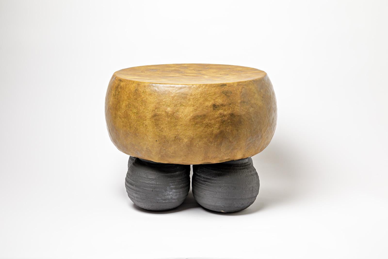 Black and mustard glazed ceramic stool or coffee table by Mia Jensen. 
Artist signature under the base. 2023.
H : 16.1’ x 19.7’ inches.
