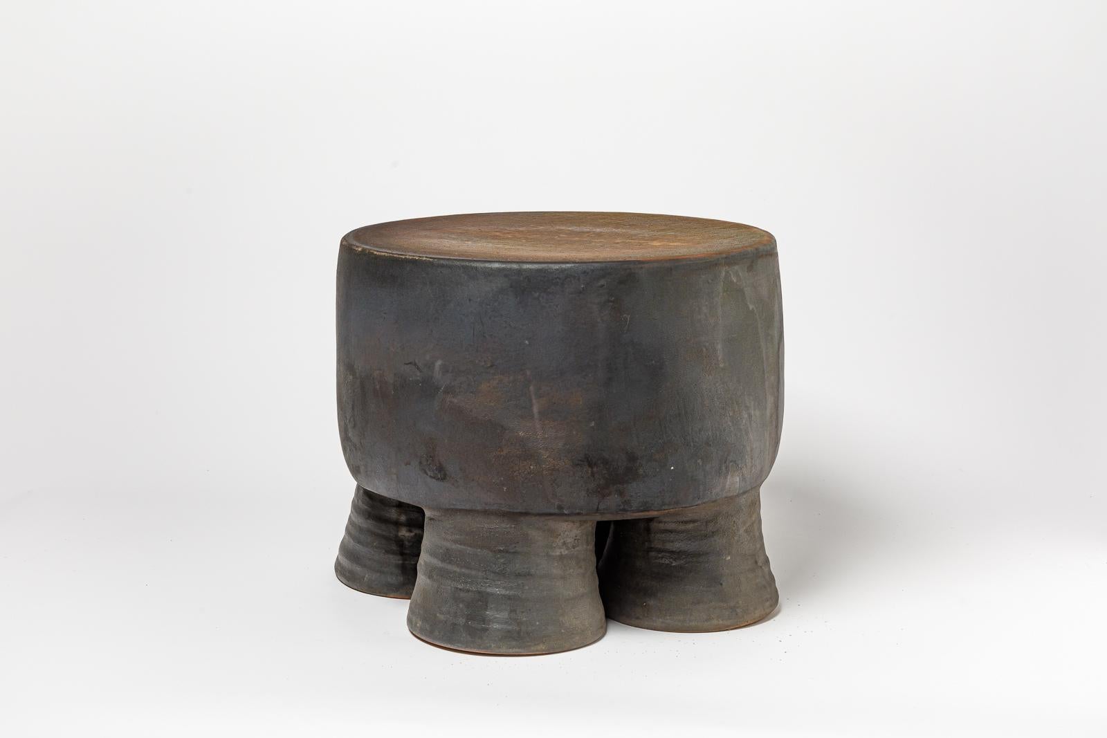 French Black and ocher glazed ceramic stool or coffee table by Mia Jensen, 2023. For Sale