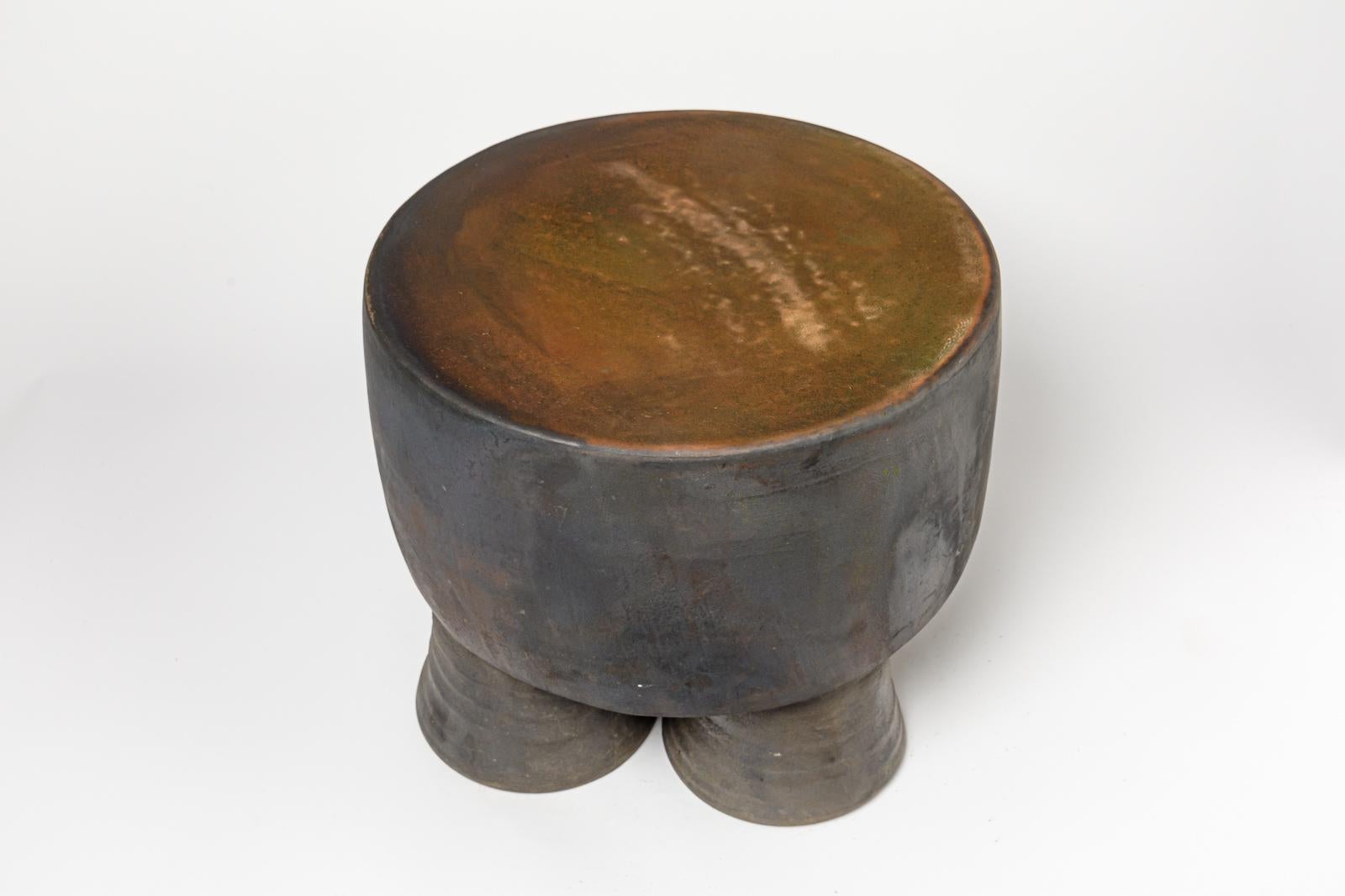 Contemporary Black and ocher glazed ceramic stool or coffee table by Mia Jensen, 2023. For Sale