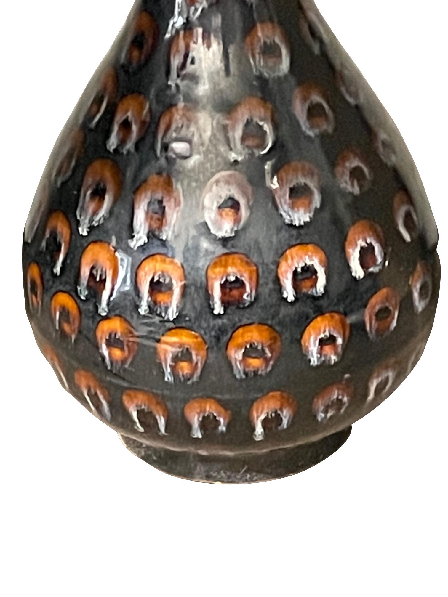 Contemporary Chinese stoneware vase with black ground with hand painted orange circles.
Part of a large collection.