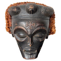 Maschera tribale nera e arancione