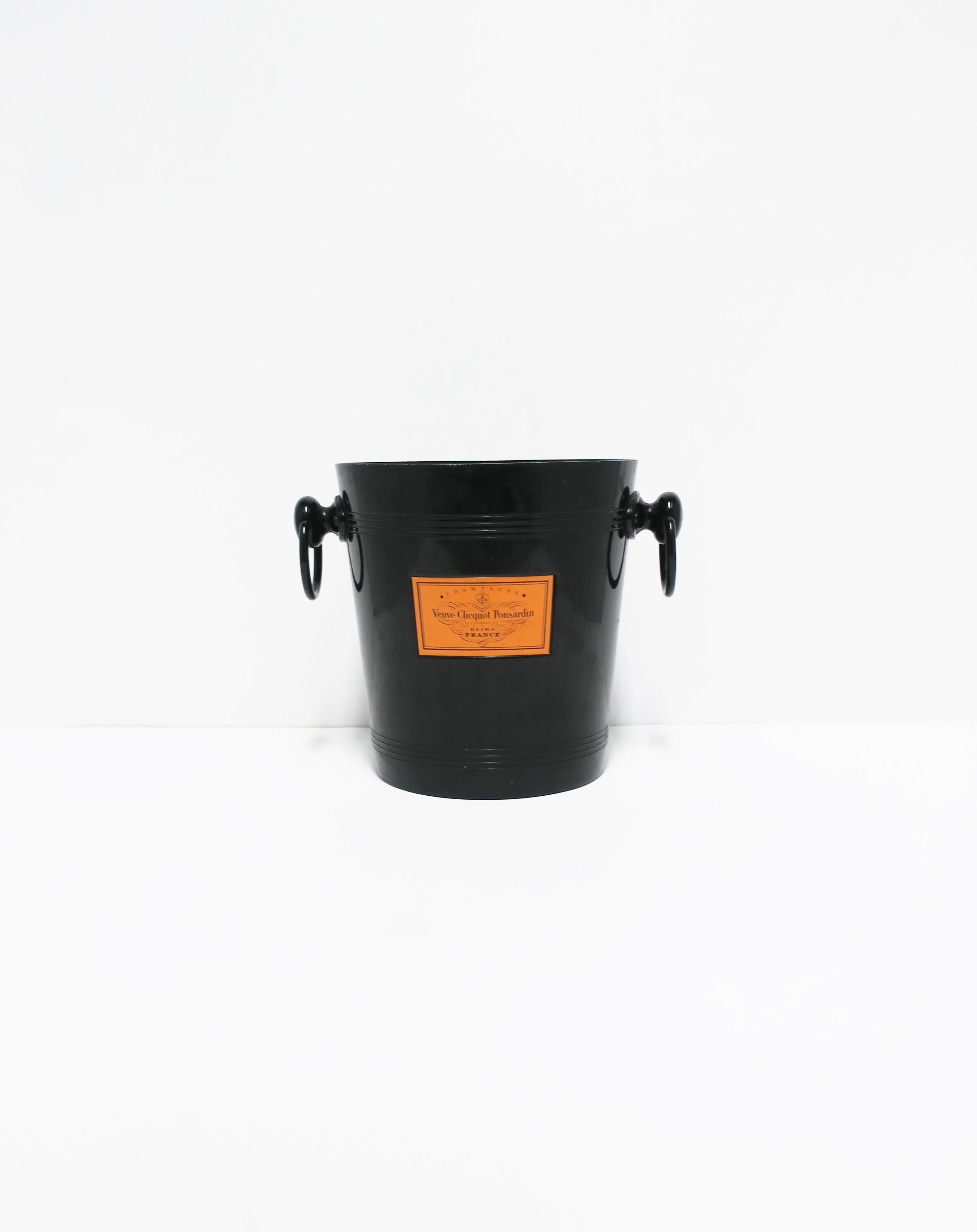 A chic black and orange Veuve Clicquot French champagne cooler or ice bucket, circa 1970s, France. This rare 