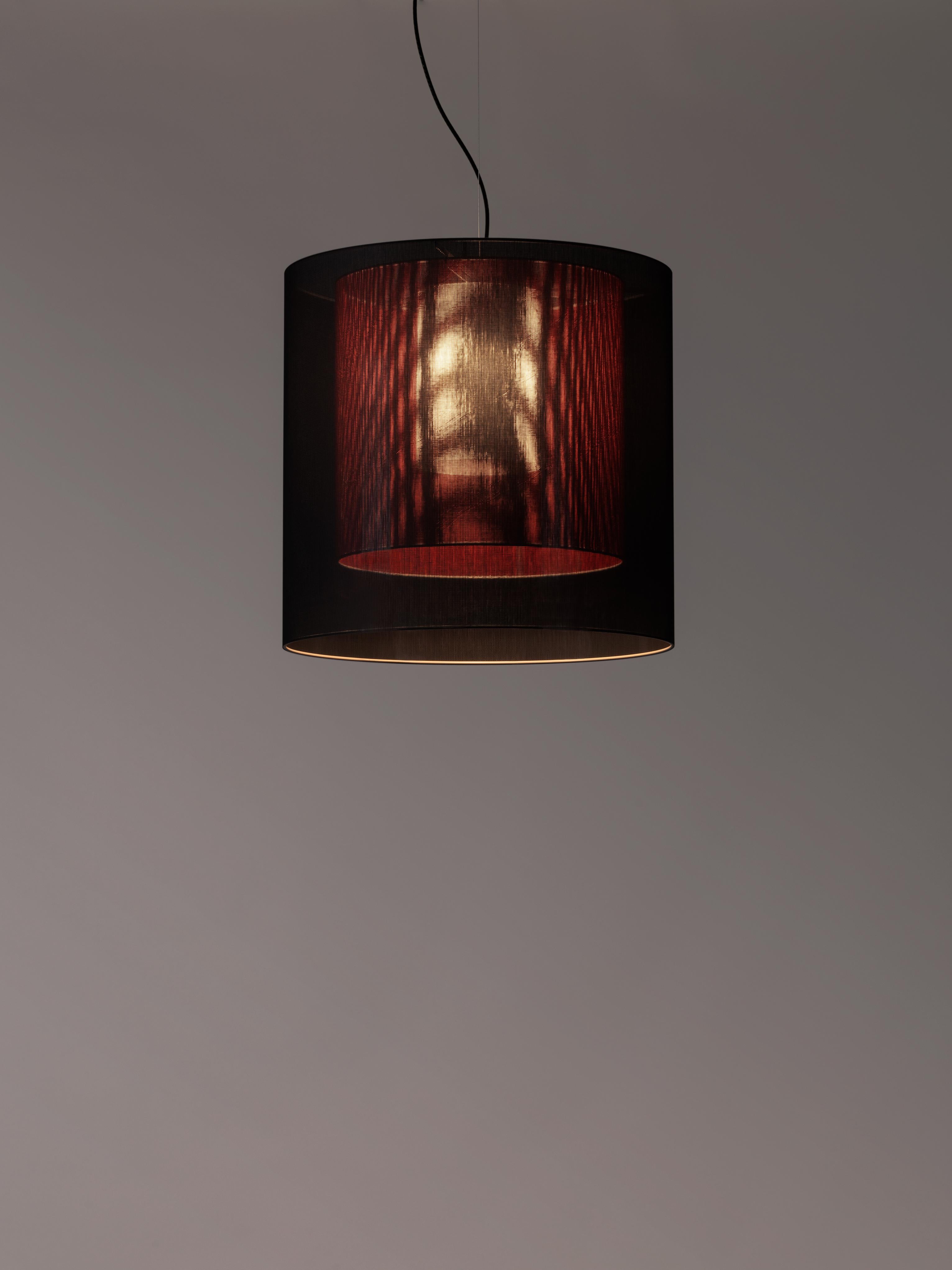 Black and red Moaré LM pendant lamp by Antoni Arola
Dimensions: D 62 x H 60 cm
Materials: Metal, polyester.
Available in other colors and sizes.

Moaré’s multiple combinations of formats and colours make it highly versatile. The series takes