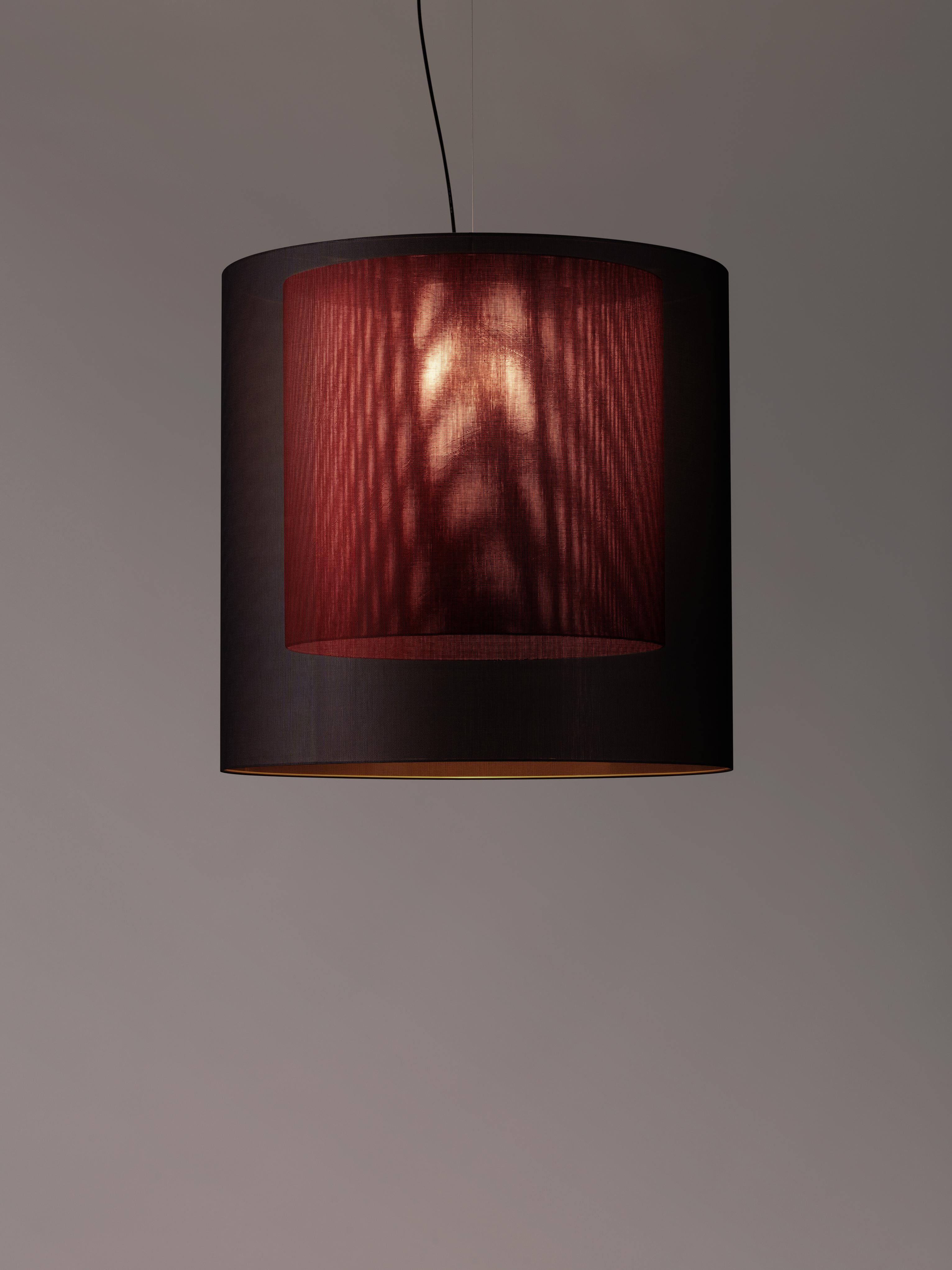 Black and red Moaré XL pendant lamp by Antoni Arola
Dimensions: D 83 x H 81 cm
Materials: Metal, polyester.
Available in other colors and sizes.

Moaré’s multiple combinations of formats and colours make it highly versatile. The series takes