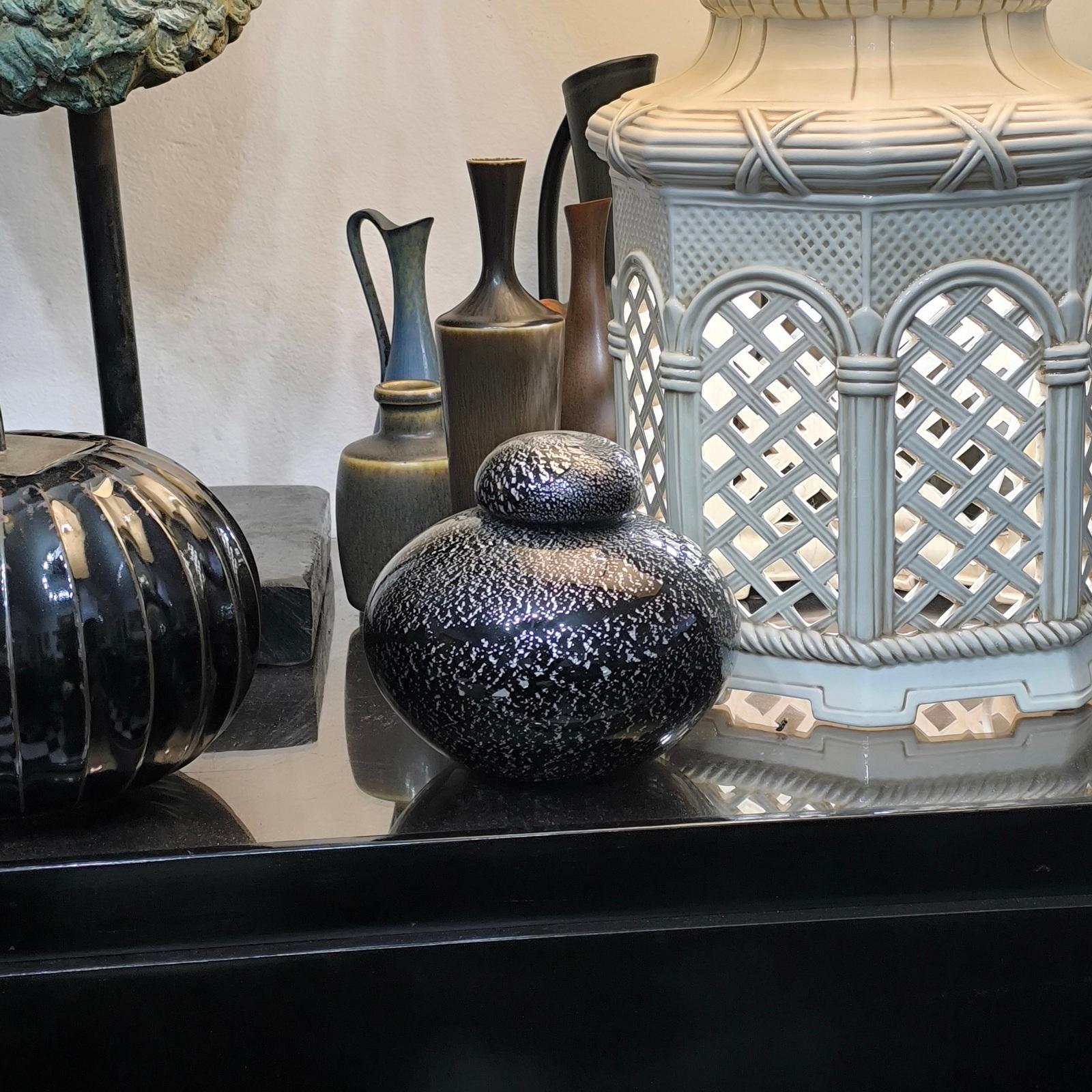 Rare Archimede Seguso Lidded Vase, Black Amethyst Glass with Silver Spread Foil
This stunning Murano vase with lid by Seguso makes a statement all by itself.
The Italian maestro used abundant random silver foil to create a very abstract design.

