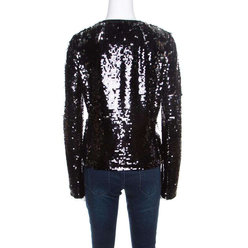 A perfect piece of party clothing for fashion lovers, this Dolce & Gabbana jacket is sure to stand out and make a statement. Constructed in black sequin paillette embellished fabric, this jacket is sure to make even the simplest of looks ready for