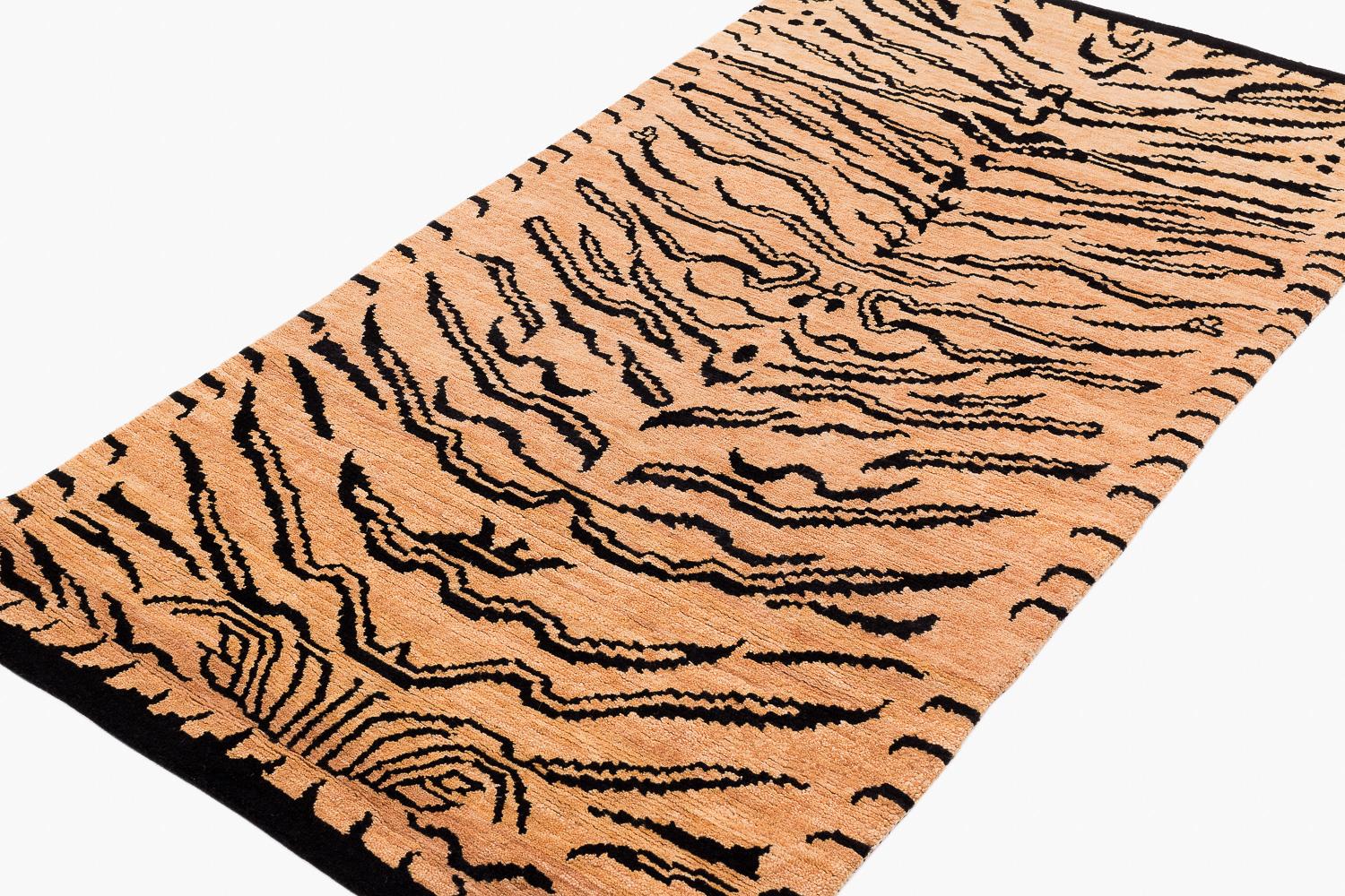 This Tiger rug embodies a traditional and versatile pattern, both contemporary and timelessly classic. Shown in black and natural tan, colored with vegetable dyes. Joseph Carini was inspired by the patterns on the tiger pelt and traditional Tibetan